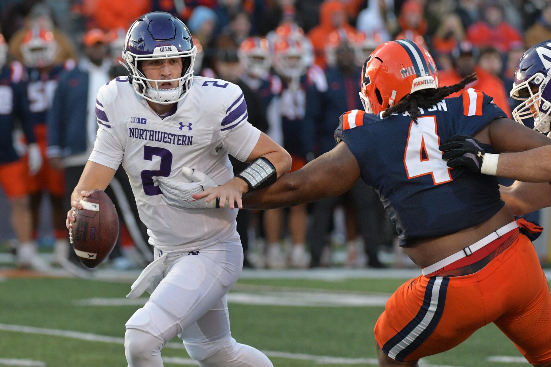 Illinois Fighting Illini defensive tackle Jer'Zhan Newton (4) sacks Northwestern Wildcats quarterback Ben Bryant (2) during the first half at Memorial Stadium.