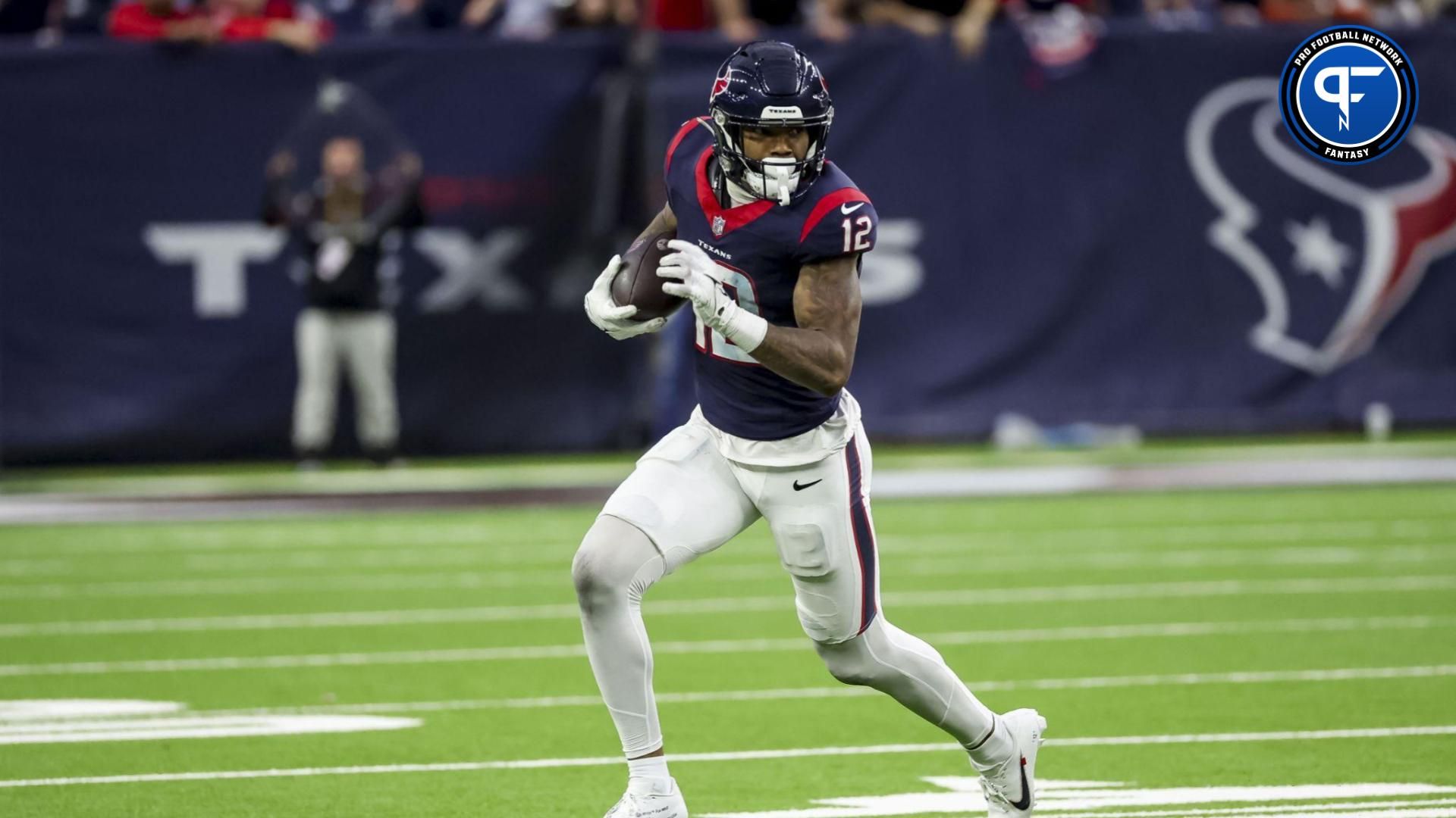 Houston Texans wide receiver Nico Collins (12) runs with the ball during the second quarter in a 2024 AFC wild card game at NRG Stadium.