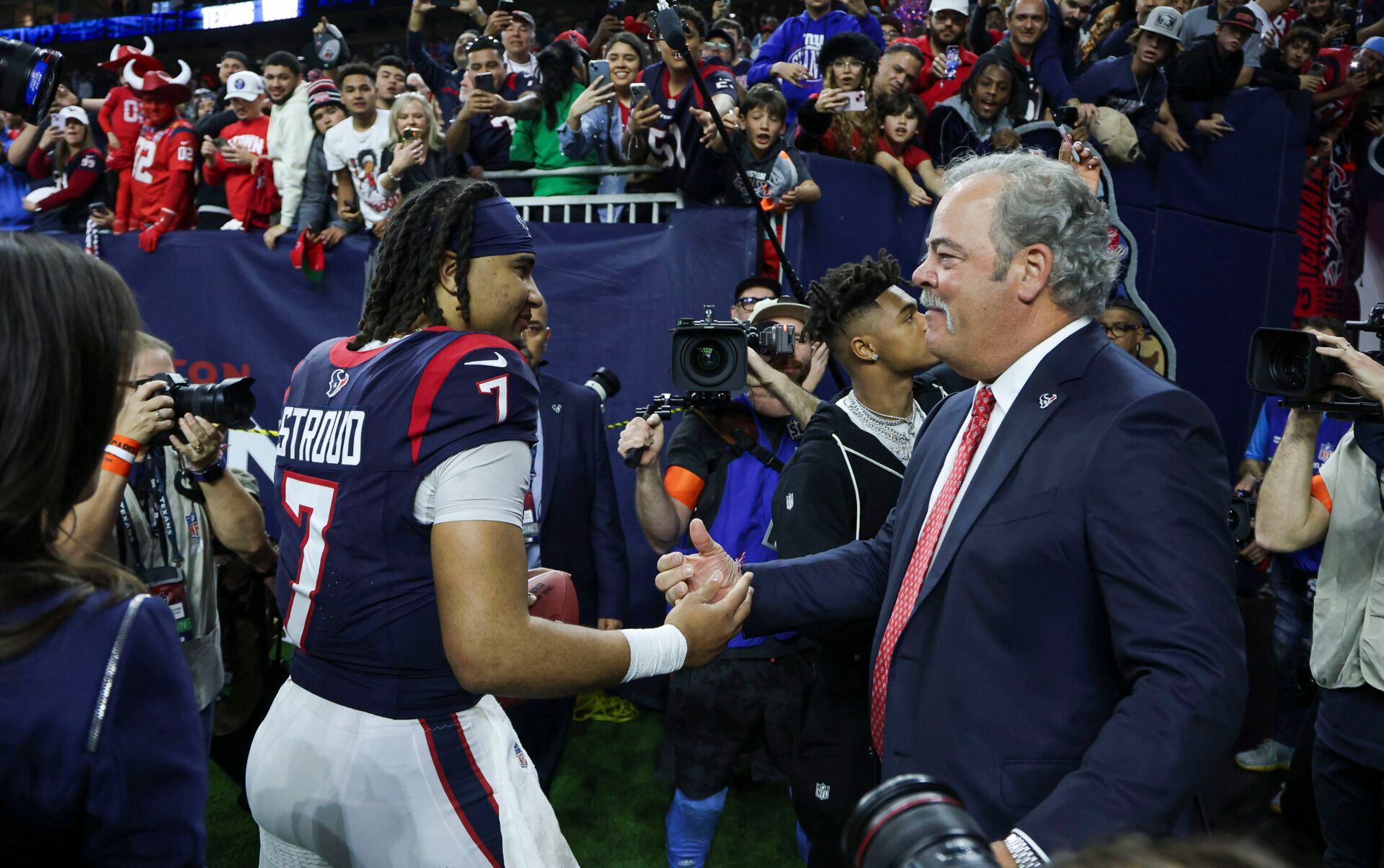 Houston Texans chief executive officer Cal McNair (right) greets quarterback C.J. Stroud (7) after a 2024 AFC wild card game against the Cleveland Browns at NRG Stadium.