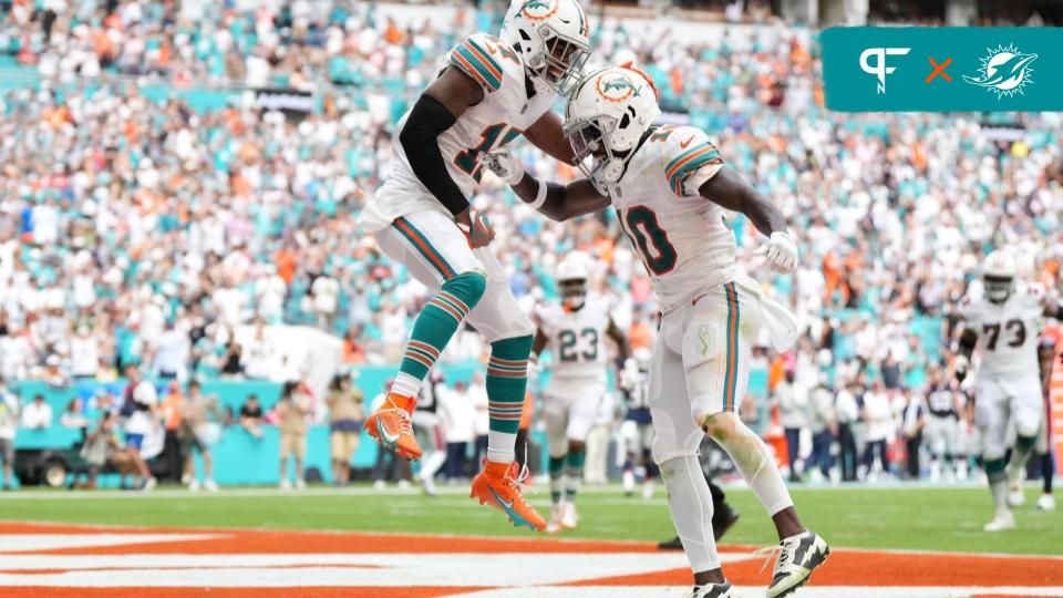 Miami Dolphins wide receivers Tyreek Hill (10) and Jaylen Waddle (17) celebrate after a touchdown.