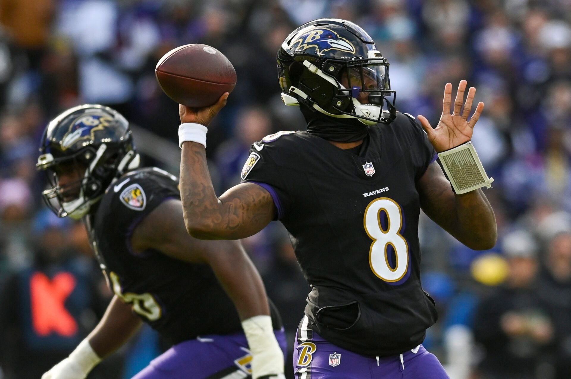 Baltimore Ravens quarterback Lamar Jackson (8) throws during the during the first quarter against the Miami Dolphins at M&T Bank Stadium.