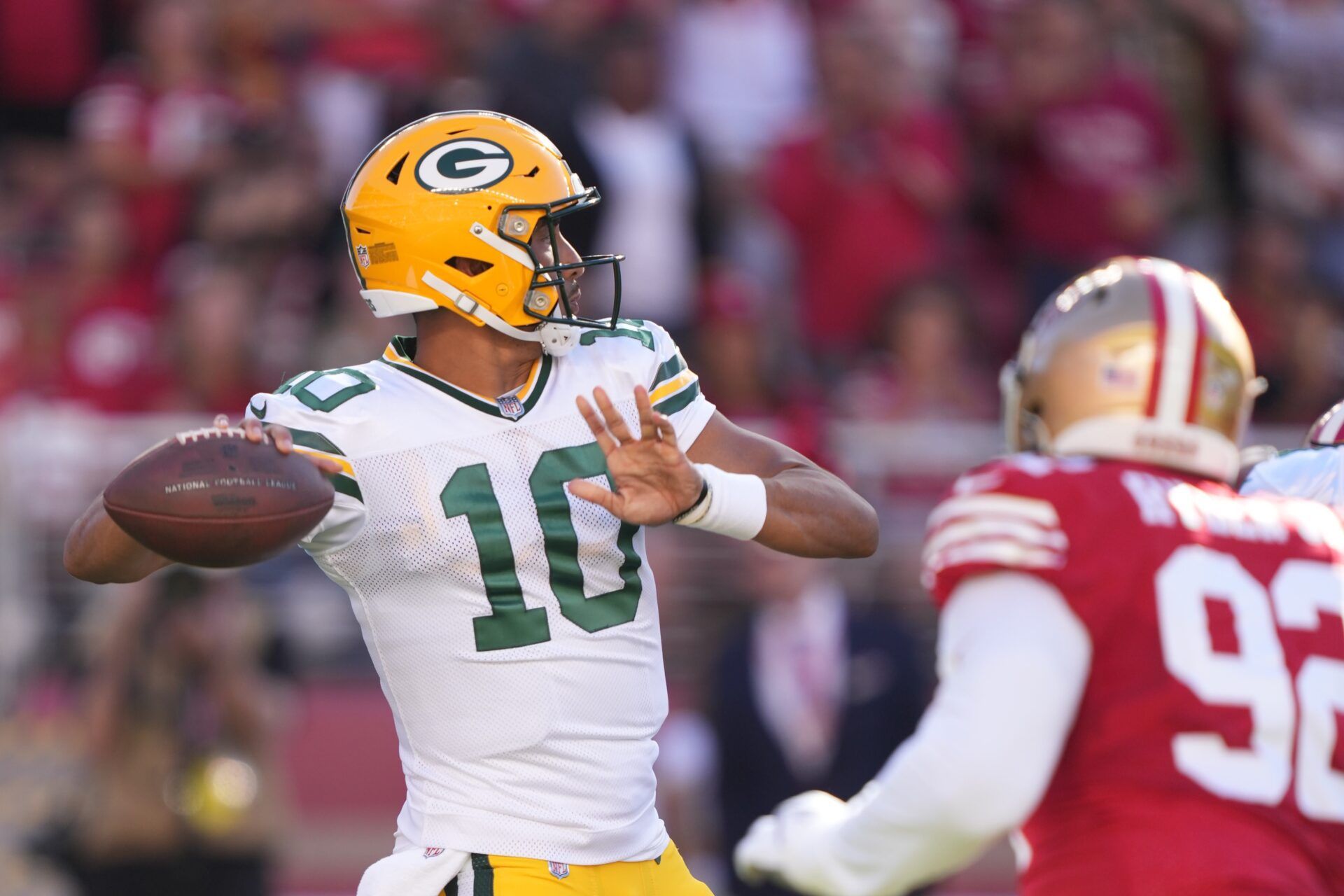 Green Bay Packers quarterback Jordan Love (10) passes the football against San Francisco 49ers defensive end Kerry Hyder Jr. (92) during the first quarter at Levi's Stadium.