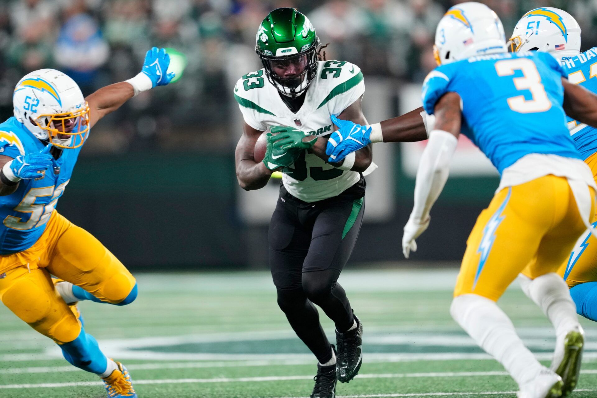 New York Jets running back Dalvin Cook (33) runs the ball against the Los Angeles Chargers defense