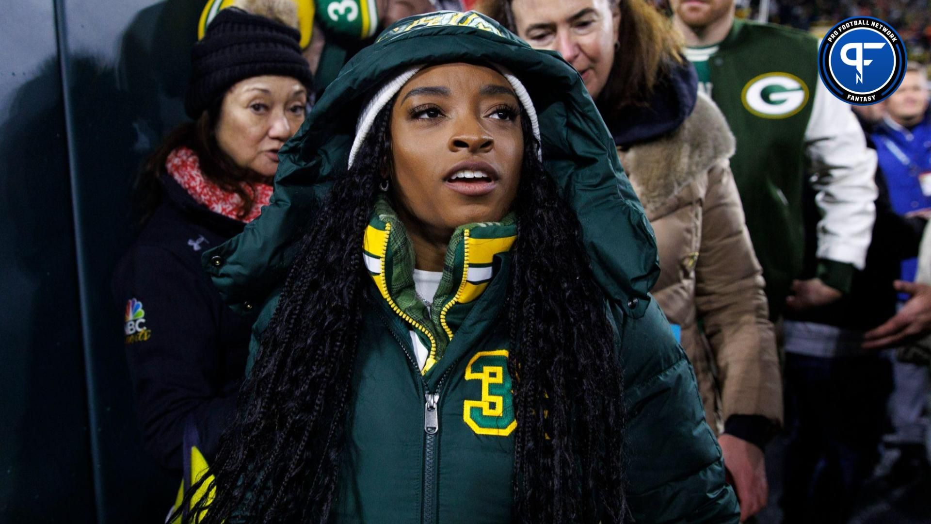 Simone Biles looks on during warmups prior to the game between the Kansas City Chiefs and Green Bay Packers at Lambeau Field.