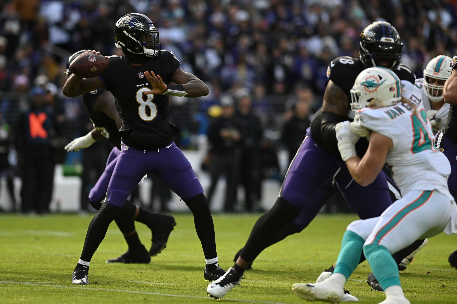 Baltimore Ravens quarterback Lamar Jackson (8) throws from the pocket during the first half against the Miami Dolphins at M&T Bank Stadium.