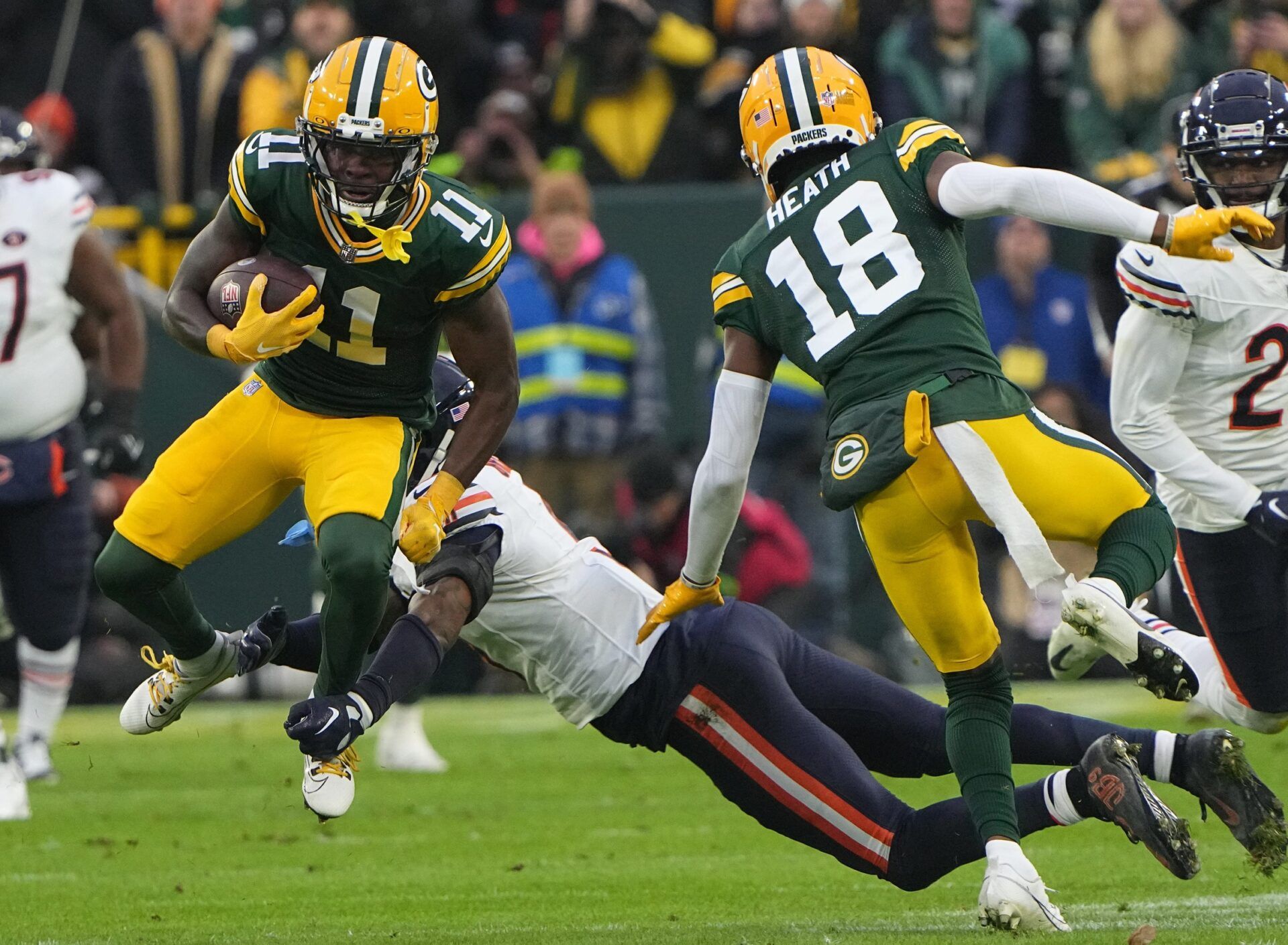 Green Bay Packers wide receiver Jayden Reed (11) makes a 44-yard reception during the second quarter of their game against the Chicago Bears Sunday, January 7, 2024 at Lambeau Field in Green Bay, Wisconsin.