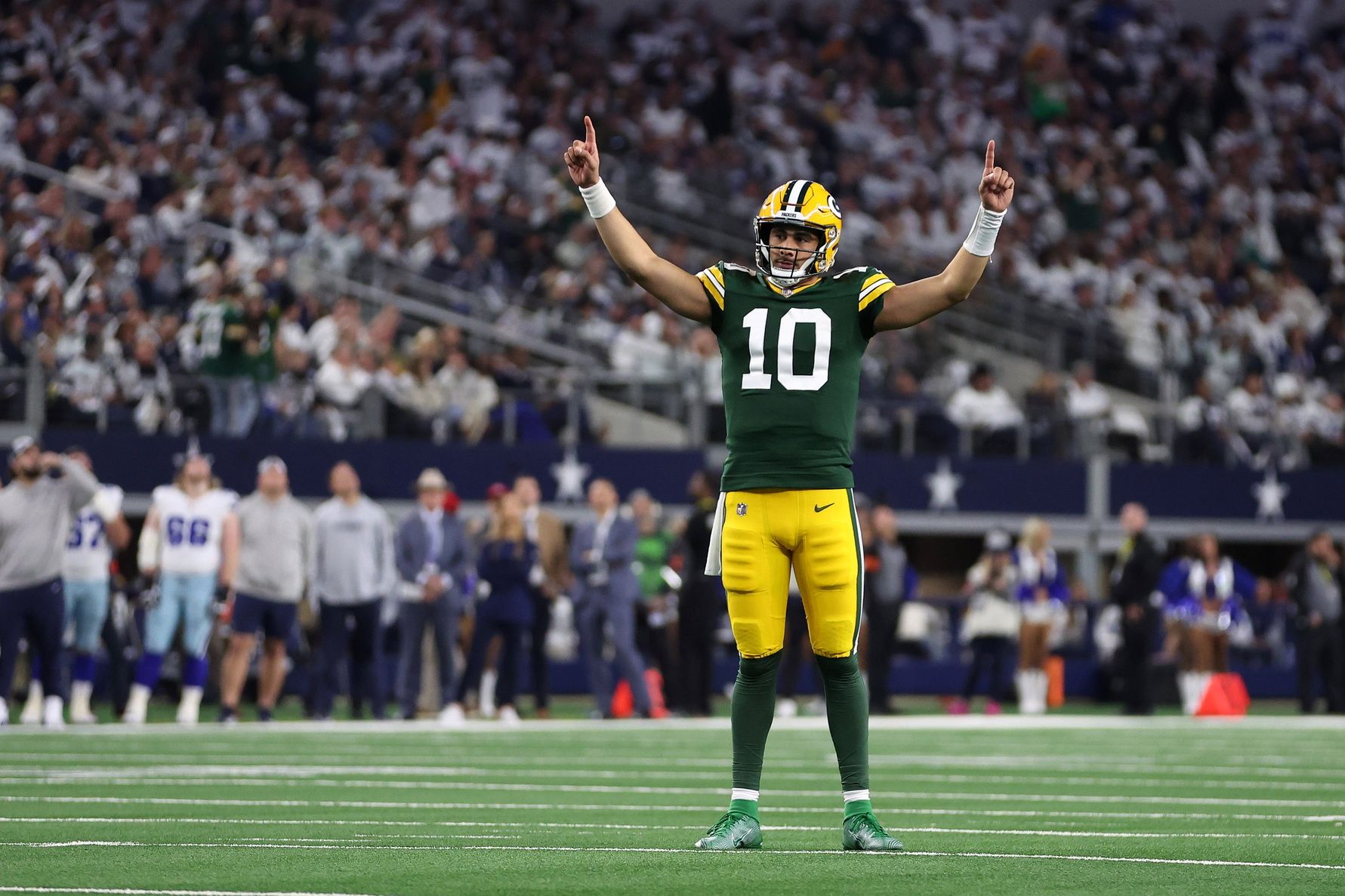 Green Bay Packers quarterback Jordan Love (10) reacts after a touchdown against the Dallas Cowboys during the second half of the 2024 NFC wild card game at AT&T Stadium.