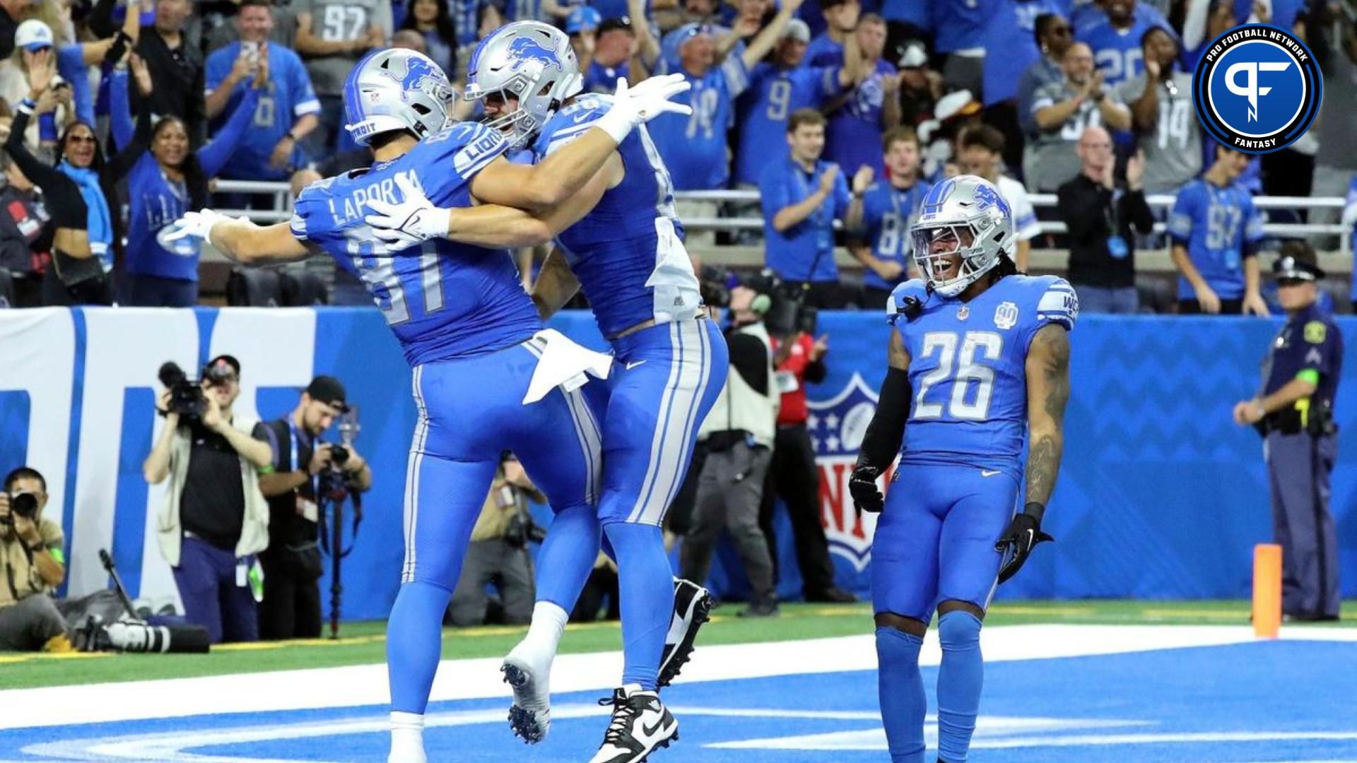 Detroit Lions tight ends Sam LaPorta (87), Brock Wright (89) and running back Jahmyr Gibbs (26) celebrate LaPorta's touchdown during first-half action vs. the Atlanta Falcons at Ford Field in Detroit on Sunday, Sept. 24, 2023.