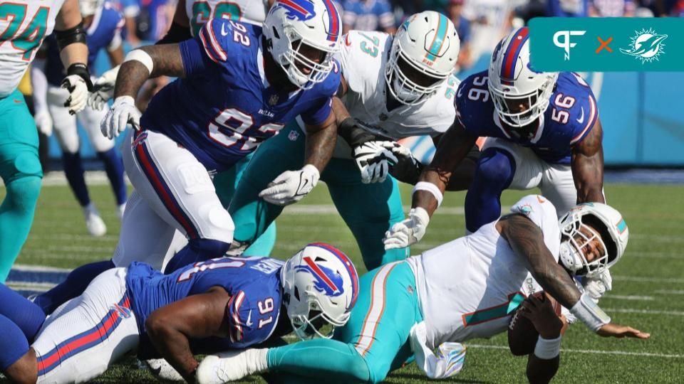 Miami Dolphins QB Tua Tagovailoa (1) is sacked by Buffalo Bills DL Ed Oliver (91).