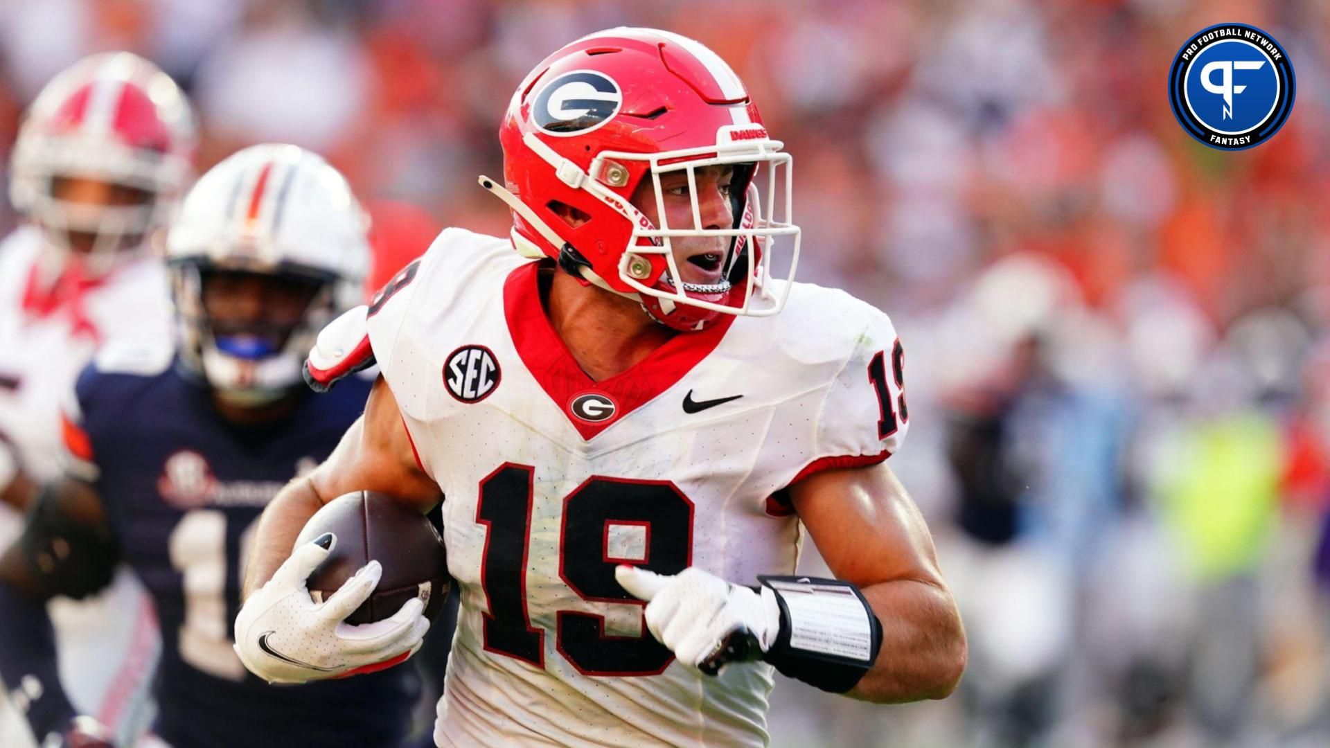 Georgia Bulldogs tight end Brock Bowers (19) carries a touchdown reception against the Auburn Tigers during the fourth quarter at Jordan-Hare Stadium.