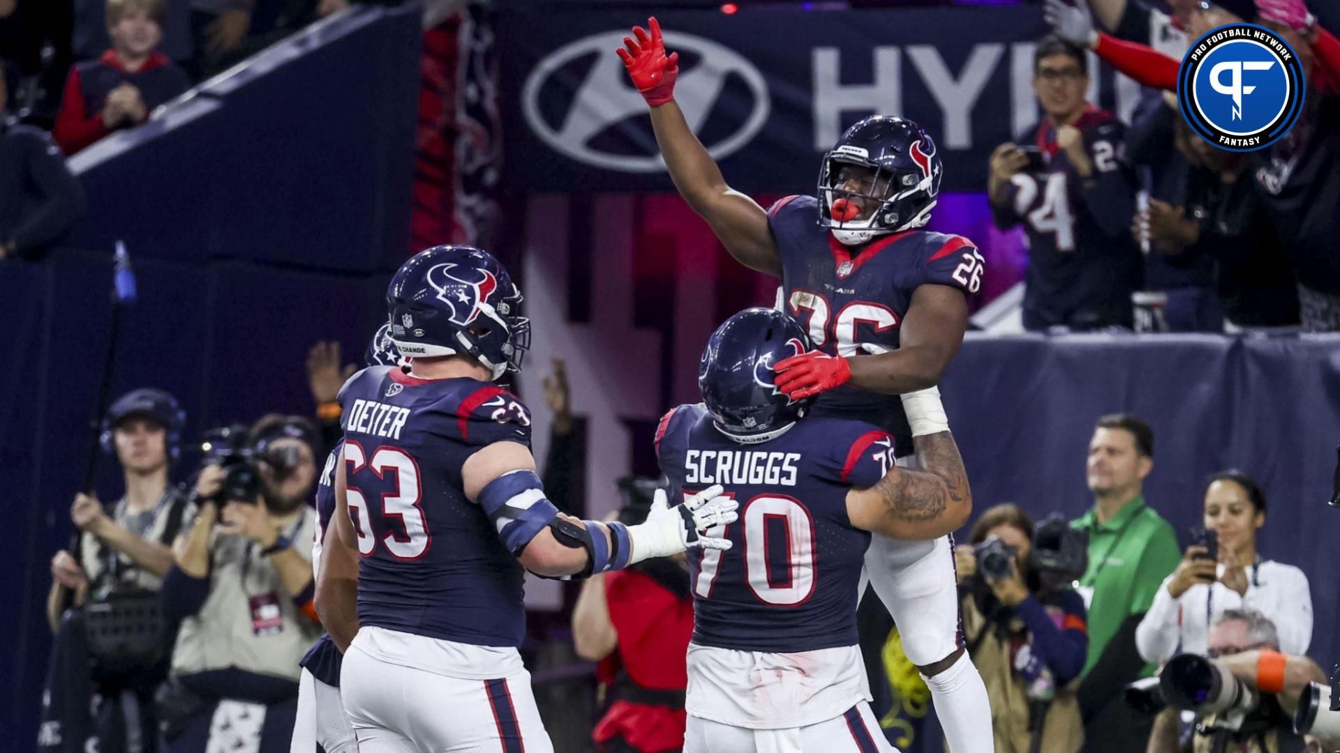 Houston Texans running back Devin Singletary (26) celebrates scoring a touchdown during the fourth quarter in a 2024 AFC wild card game at NRG Stadium.