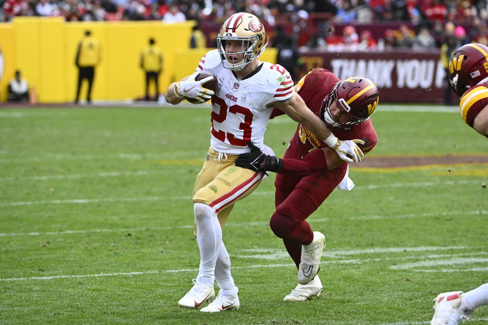 San Francisco 49ers running back Christian McCaffrey (23) carries the ball against the Washington Commanders during the second half at FedExField.