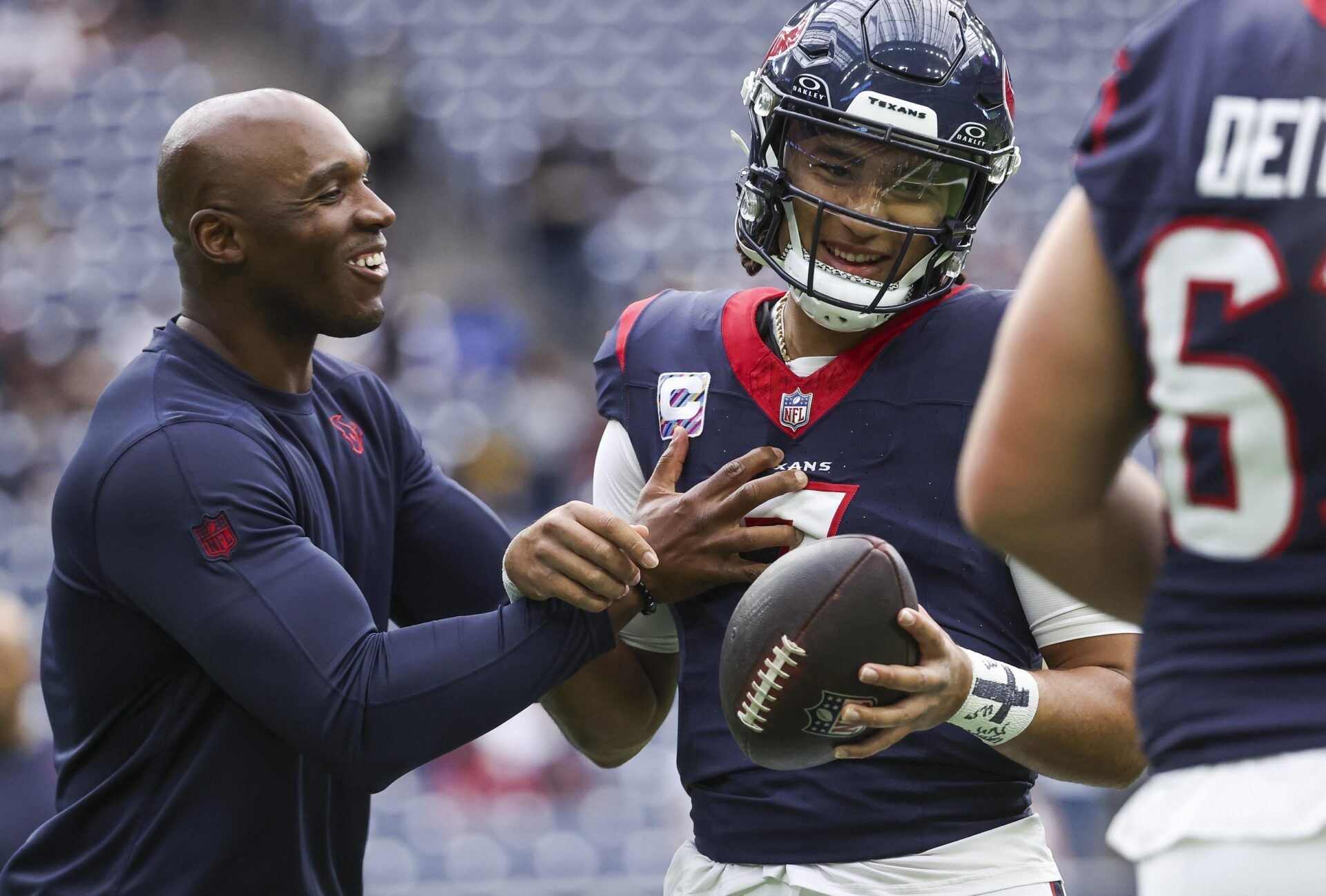 Houston Texans head coach DeMeco Ryans laughs with quarterback C.J. Stroud (7) before the game against the New Orleans Saints at NRG Stadium.