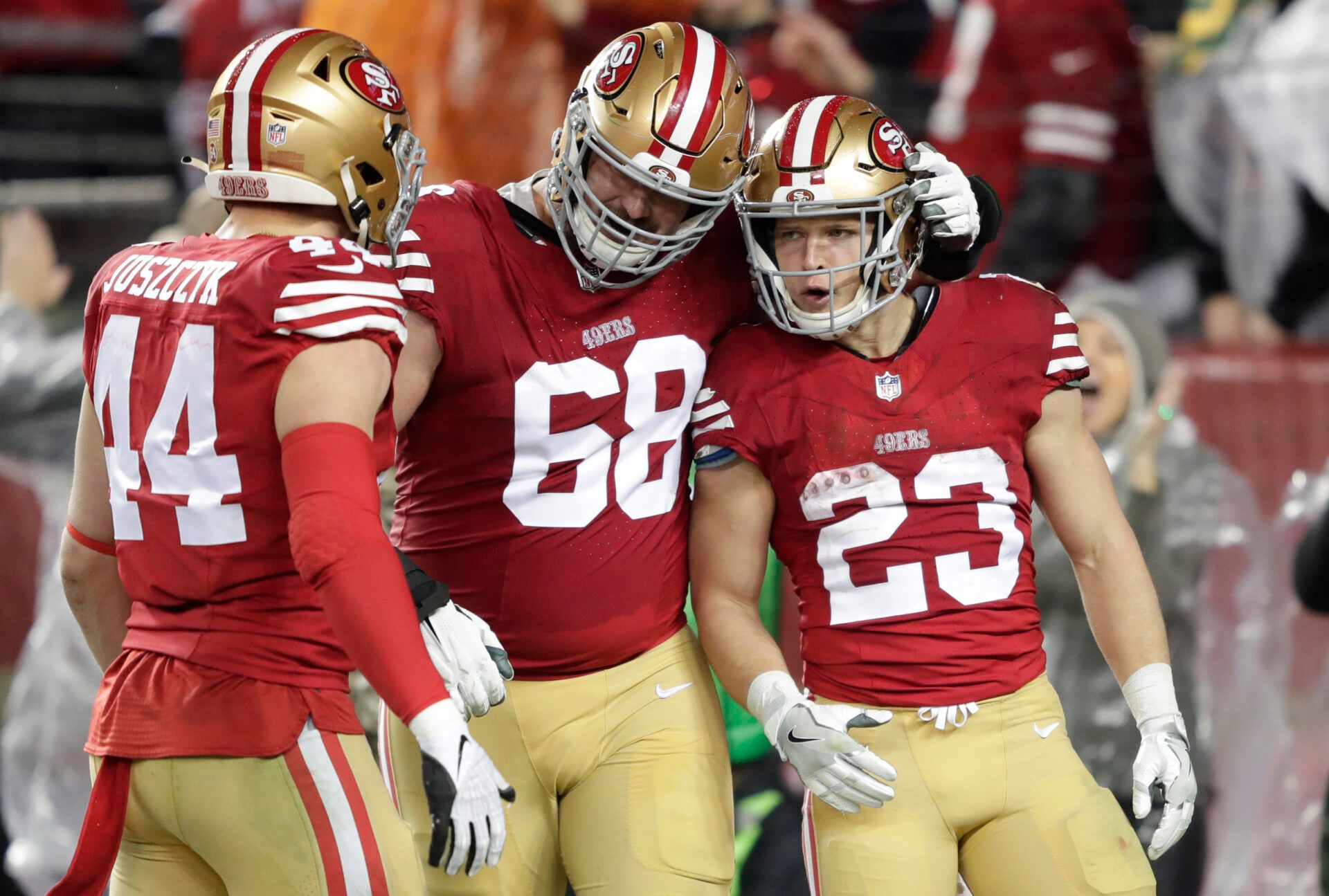 Jan 20, 2024; Santa Clara, CA, USA; San Francisco 49ers running back Christian McCaffrey (23) celebrates scoring a touchdown in the third quarter with fullback Kyle Juszczyk (44) and offensive tackle Colton McKivitz (68) against the Green Bay Packers in a 2024 NFC divisional round game at Levi's Stadium. Mandatory Credit: Dan Powers-USA TODAY Sports