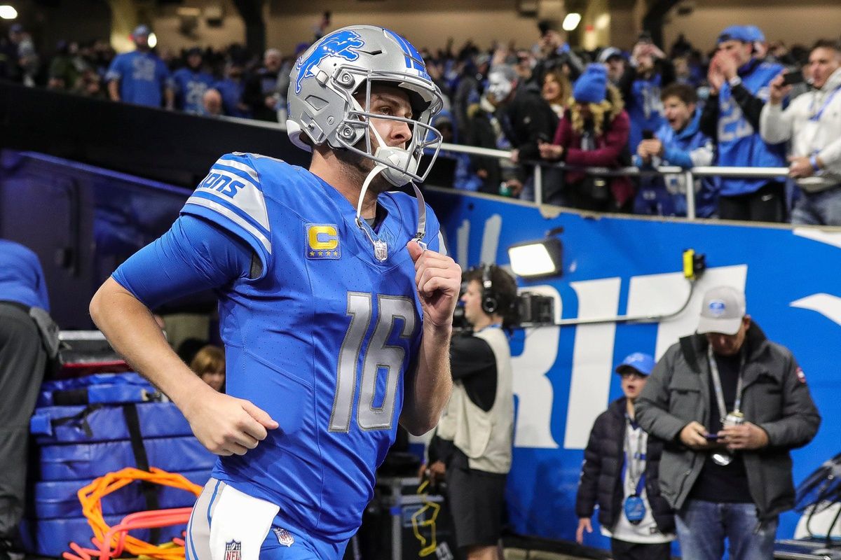 Detroit Lions QB Jared Goff (16) runs out of the tunnel.