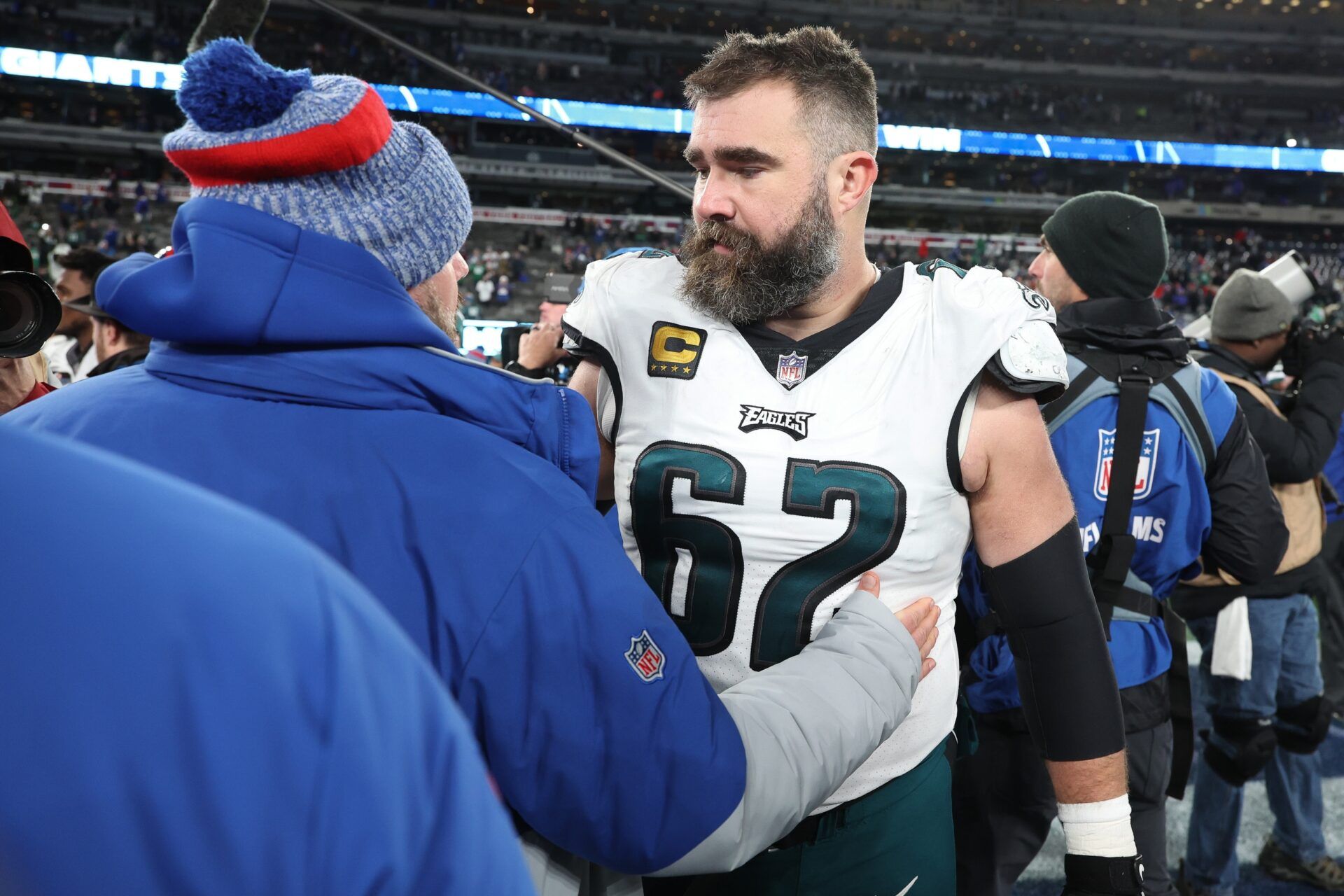 Philadelphia Eagles center Jason Kelce (62) talks with New York Giants head coach Brian Daboll after the game at MetLife Stadium.