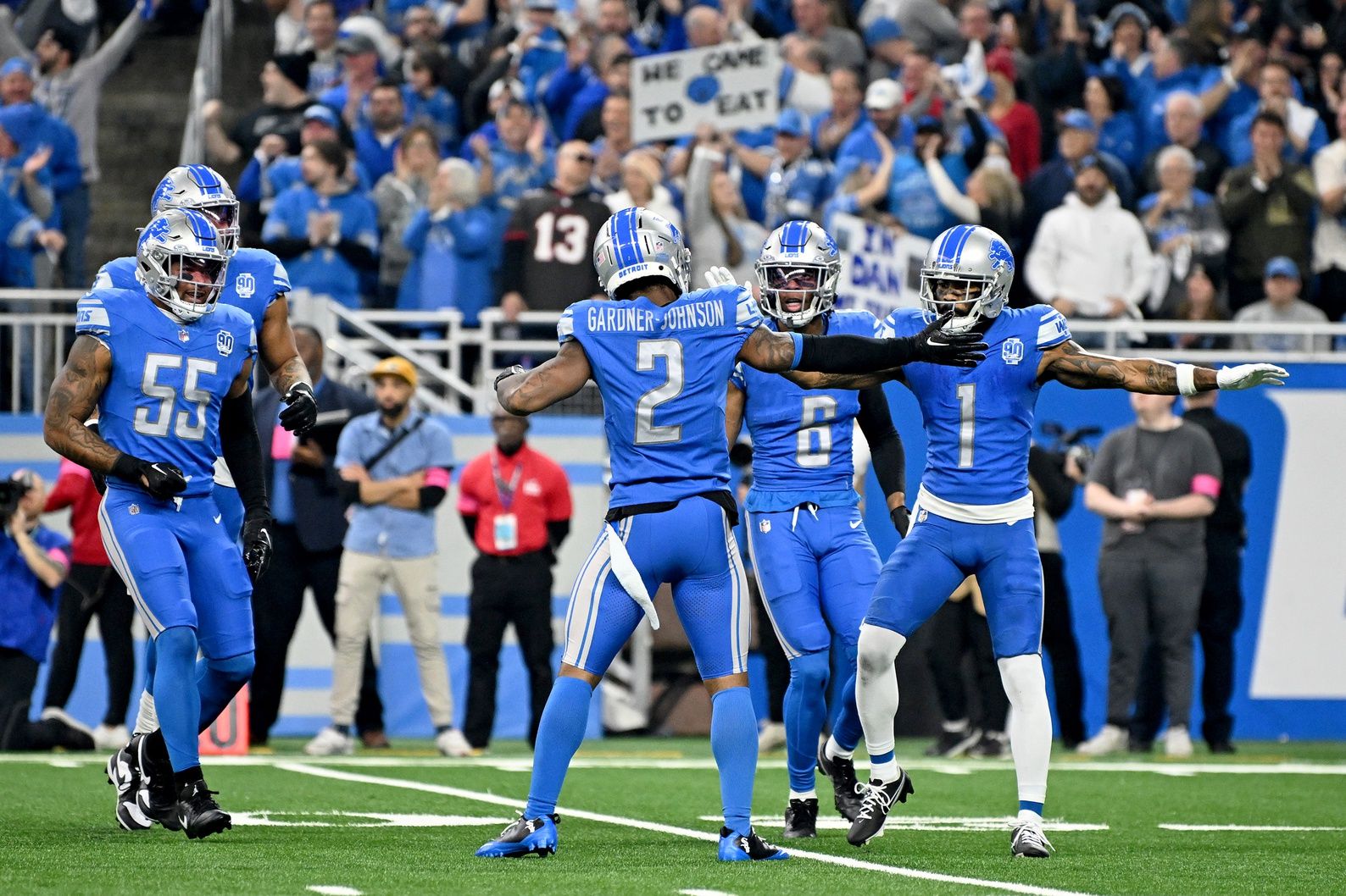 Detroit Lions safety C.J. Gardner-Johnson (2), safety Ifeatu Melifonwu (6) and cornerback Cameron Sutton (1) reacts after a play against the Tampa Bay Buccaneers during the first quarter in a 2024 NFC divisional round game at Ford Field.