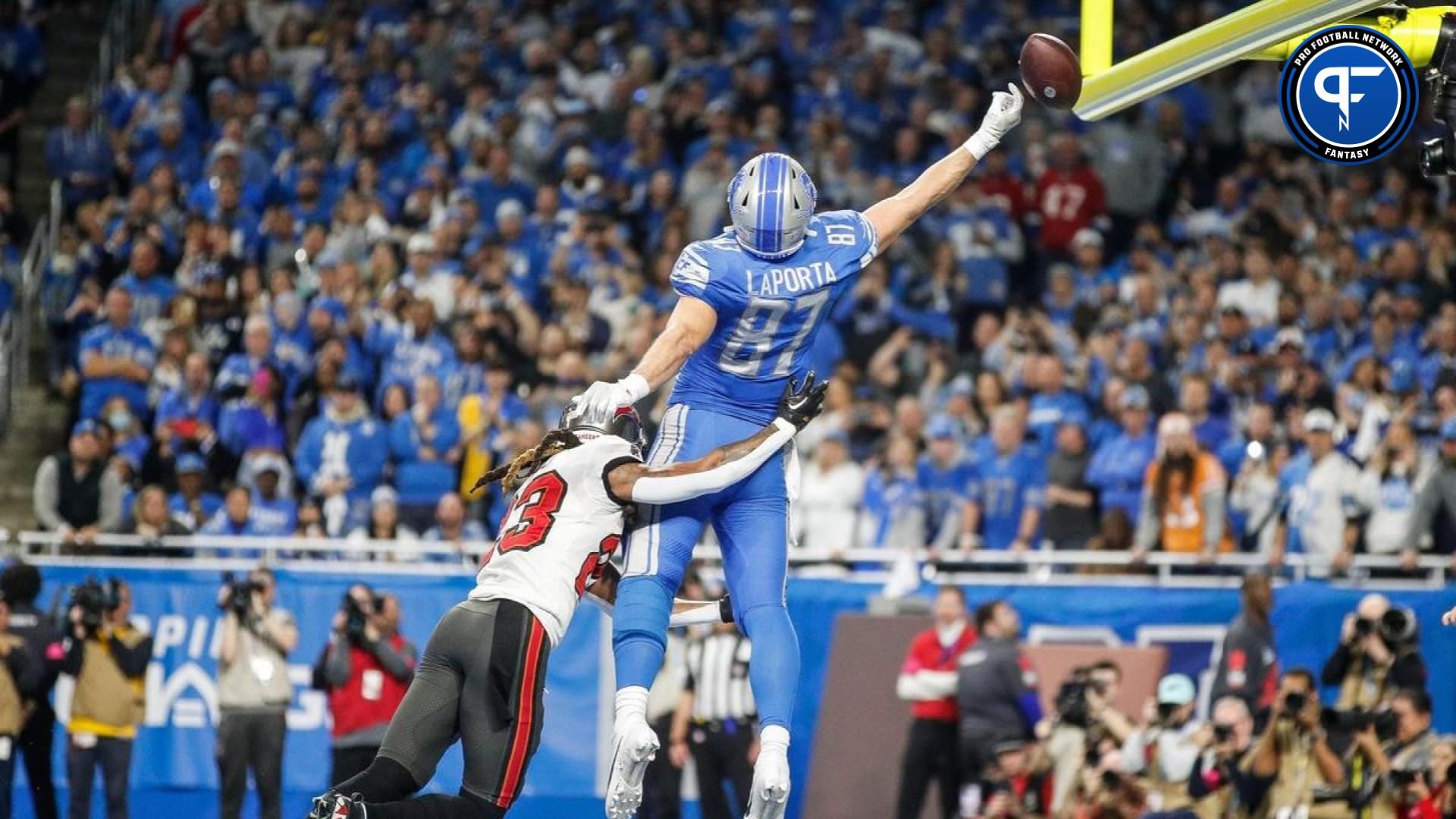 Detroit Lions tight end Sam LaPorta (87) tries to grab a pass against Tampa Bay Buccaneers safety Ryan Neal (23) during the second half in a 2024 NFC divisional round game at Ford Field.