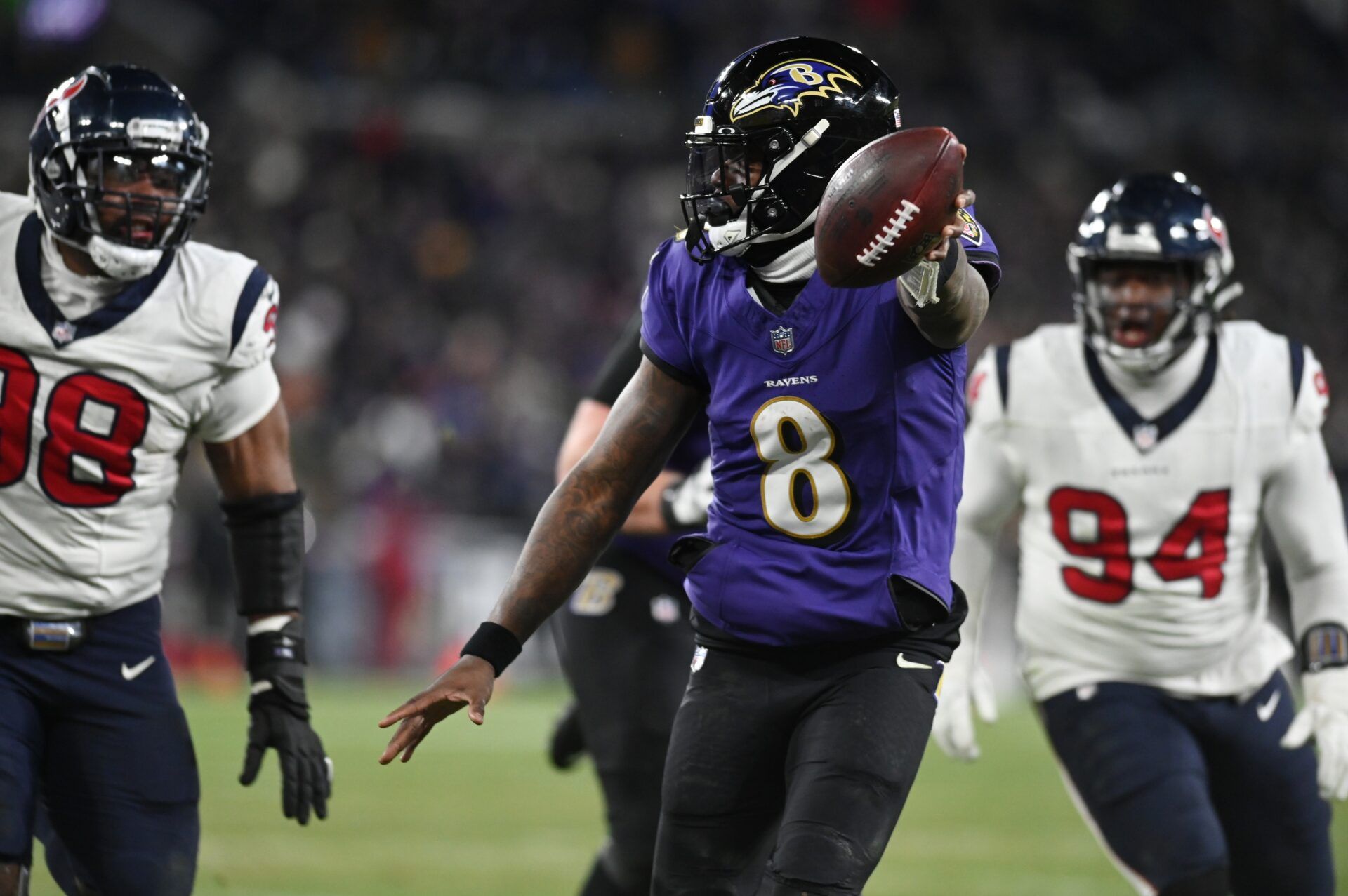 Baltimore Ravens QB Lamar Jackson (8) scores a touchdown against the Houston Texans.