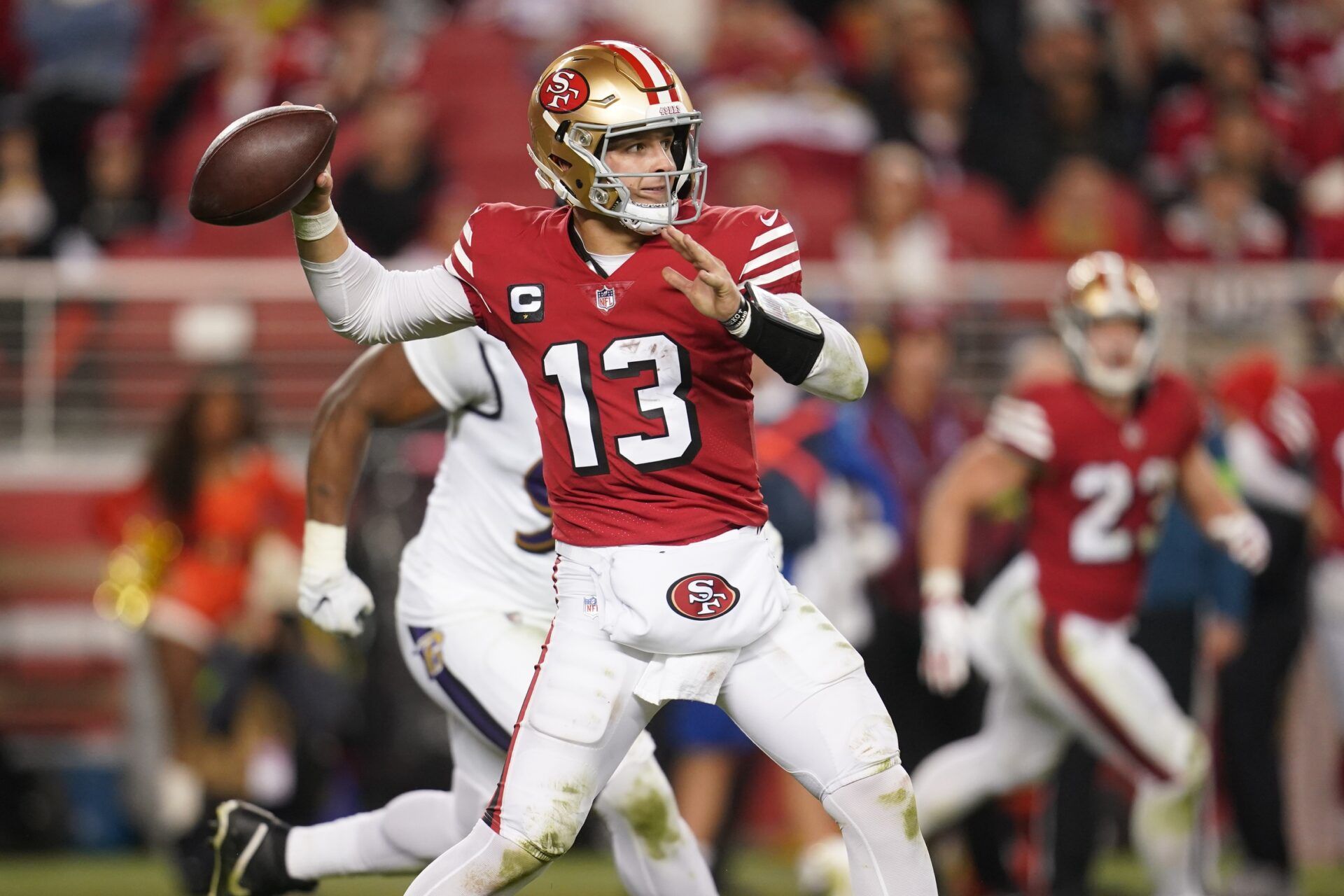 San Francisco 49ers QB Brock Purdy (13) throws a pass against the Baltimore Ravens.