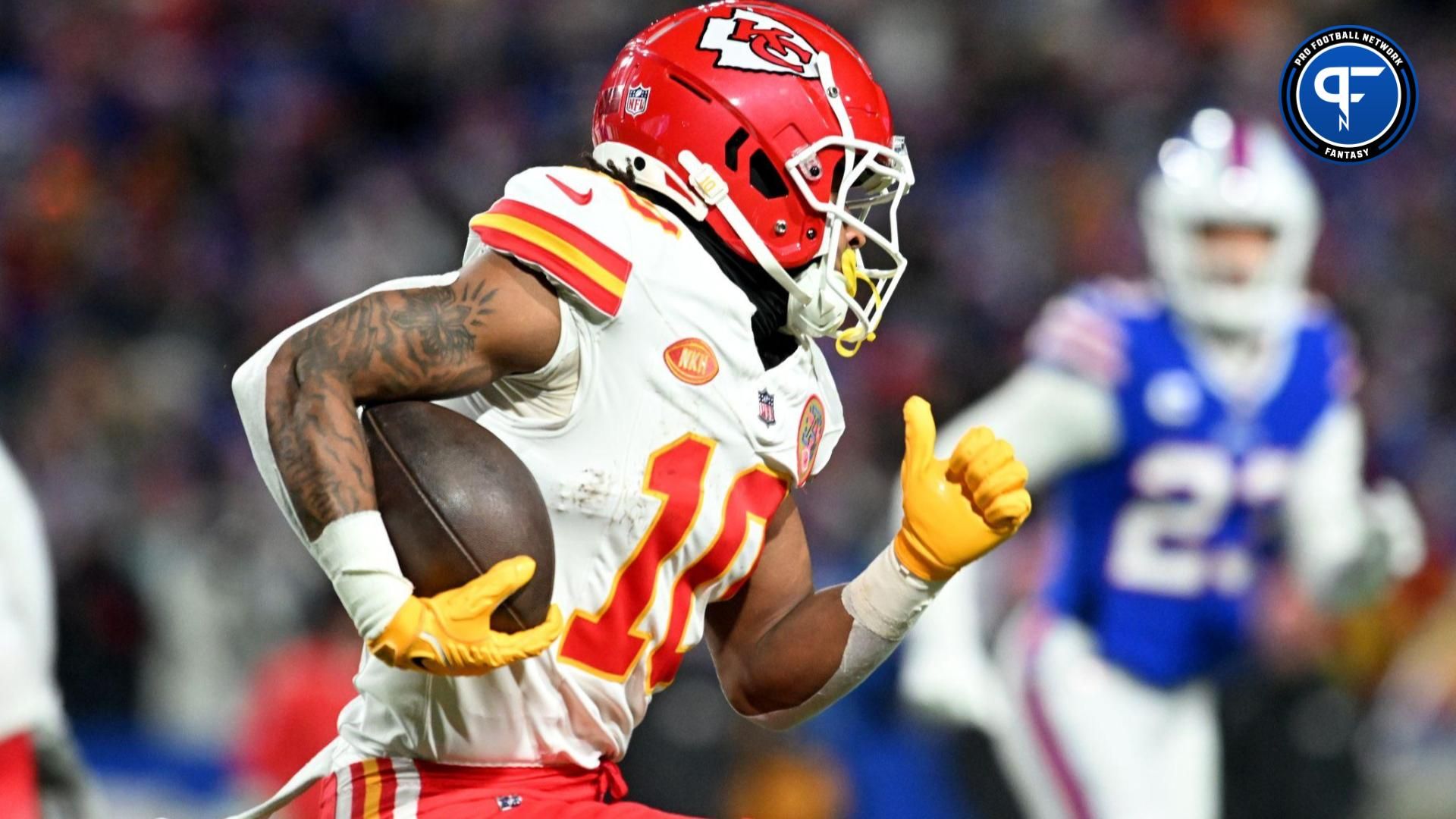 Kansas City Chiefs running back Isiah Pacheco (10) rushes the ball against the Buffalo Bills in the first half of the 2024 AFC divisional round game at Highmark Stadium.