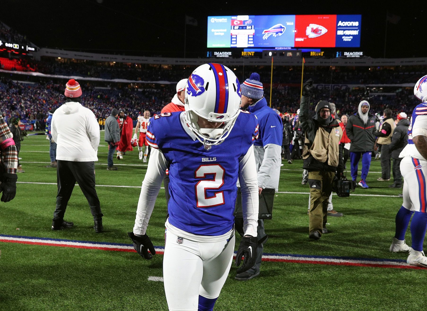 Buffalo Bills place kicker Tyler Bass (2) walks off the field after missing what would have been a game tying field goal in a 27-24 loss to the Chiefs in the divisional round.