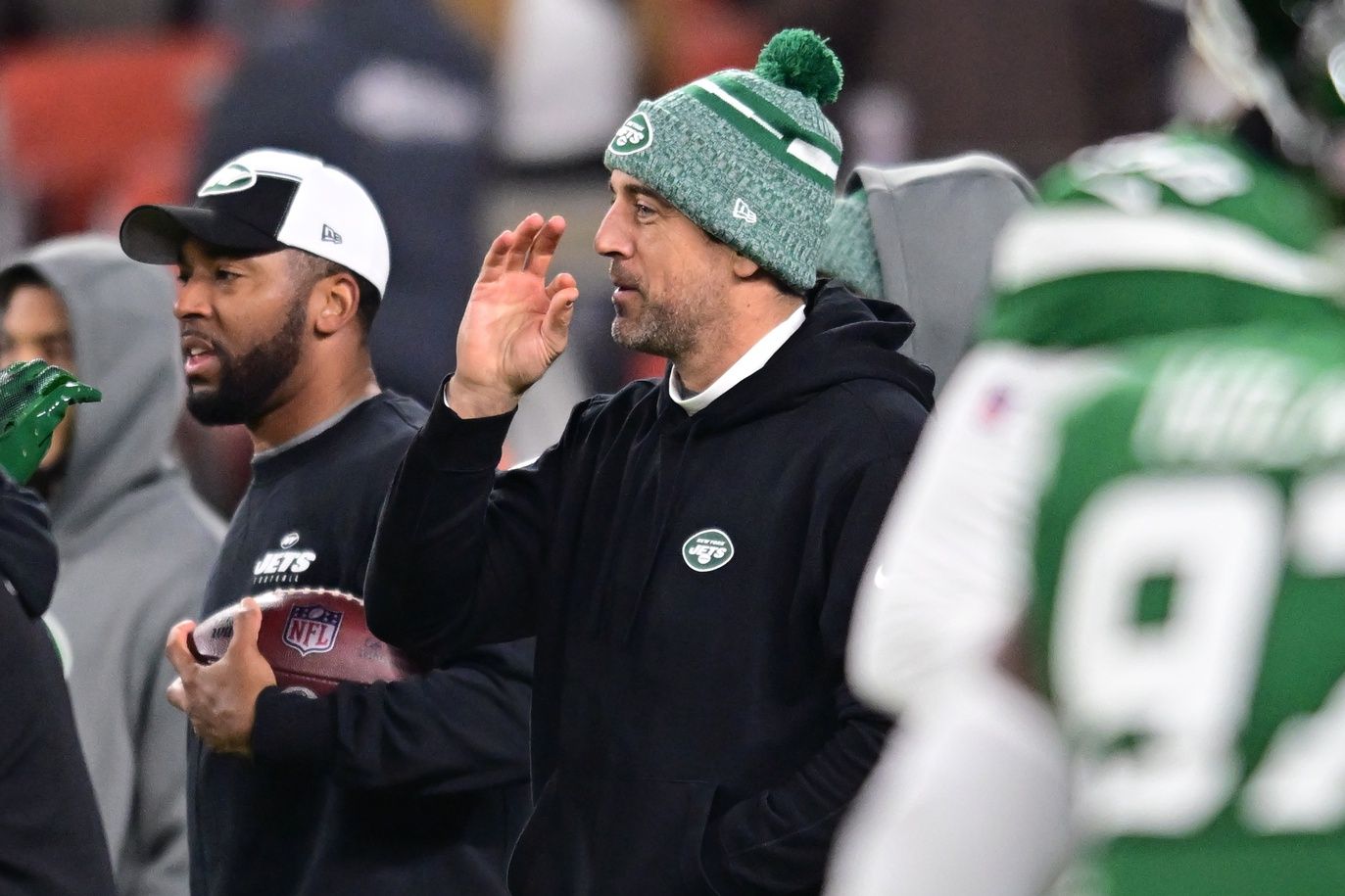 New York Jets quarterback Aaron Rodgers (center) gestures before the game between the Cleveland Browns and the Jets at Cleveland Browns Stadium.