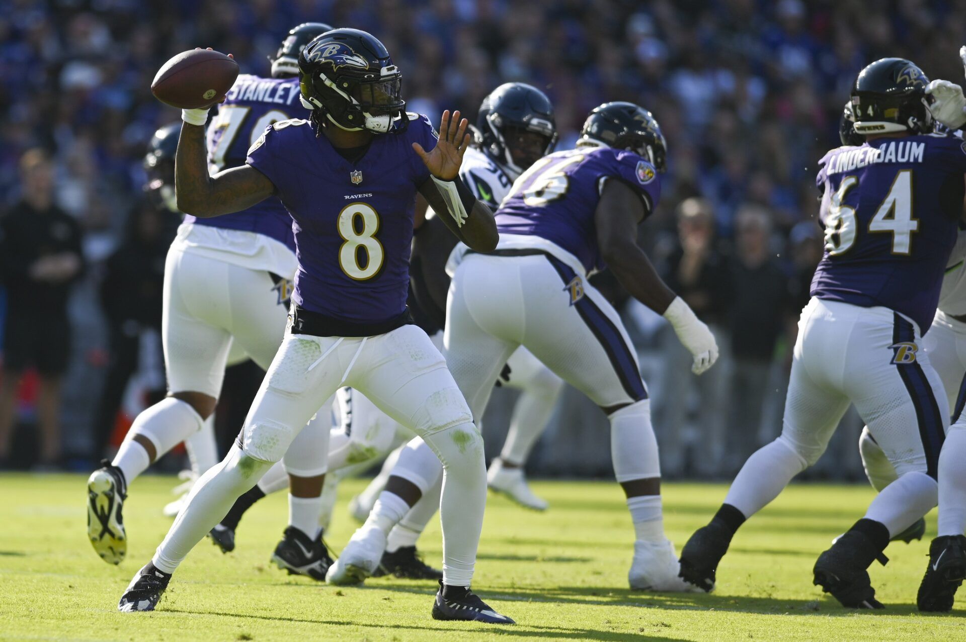 Baltimore Ravens quarterback Lamar Jackson (8) throws from the pocket during the first half against the Seattle Seahawks at M&T Bank Stadium.