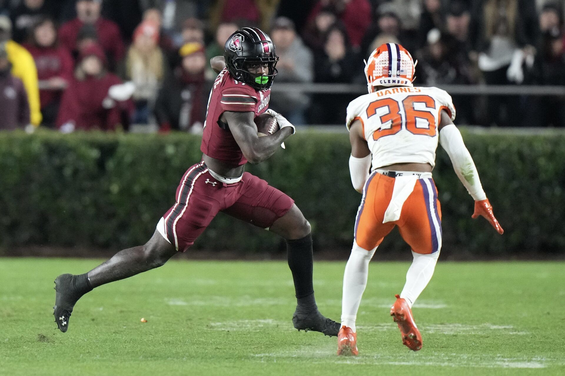 South Carolina Gamecocks wide receiver Xavier Legette (17) runs the ball against Clemson Tigers safety Khalil Barnes (36) at Williams-Brice Stadium.