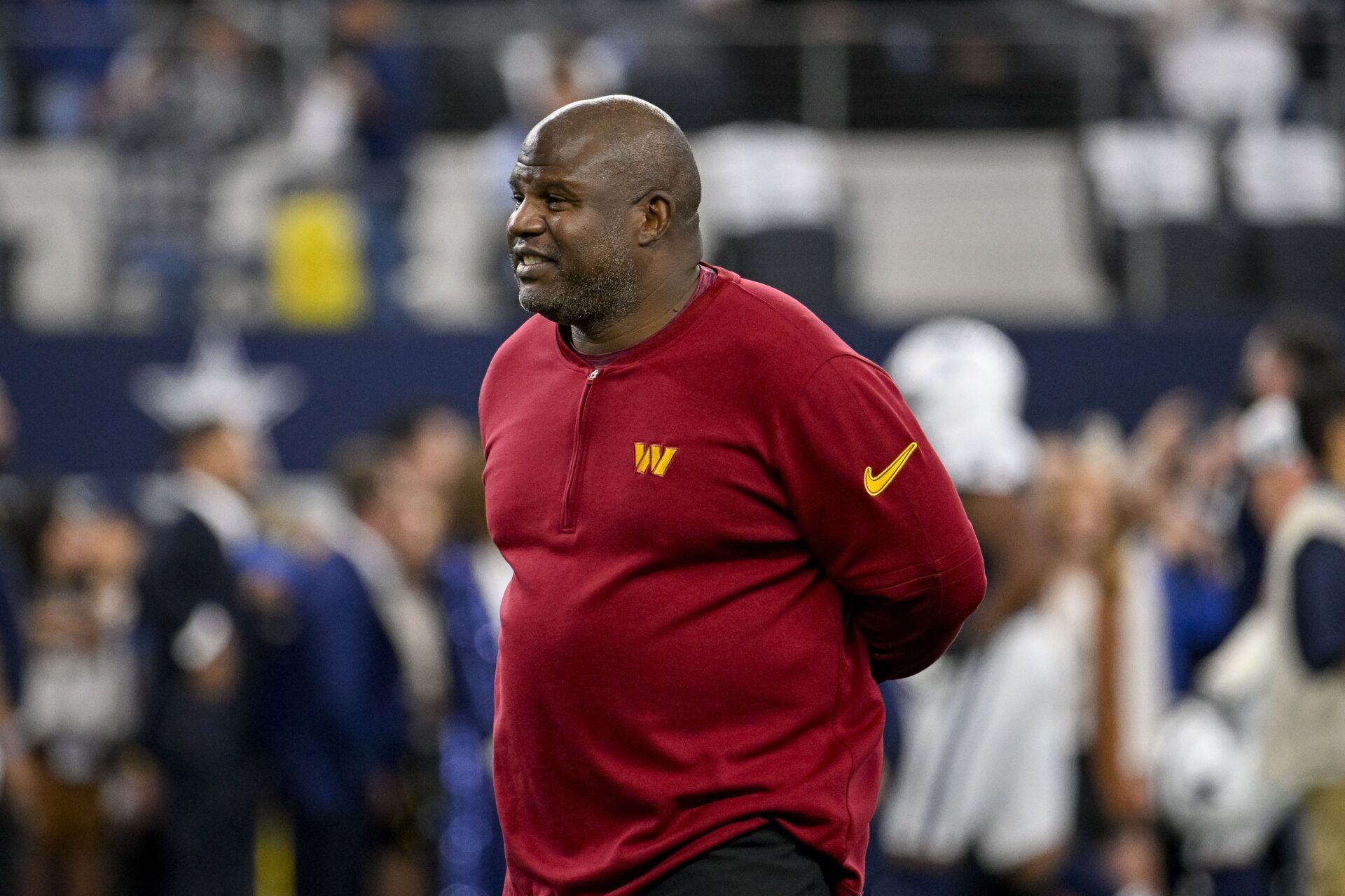 Washington Commanders OC Eric Bieniemy smiles prior to a game against the Dallas Cowboys.