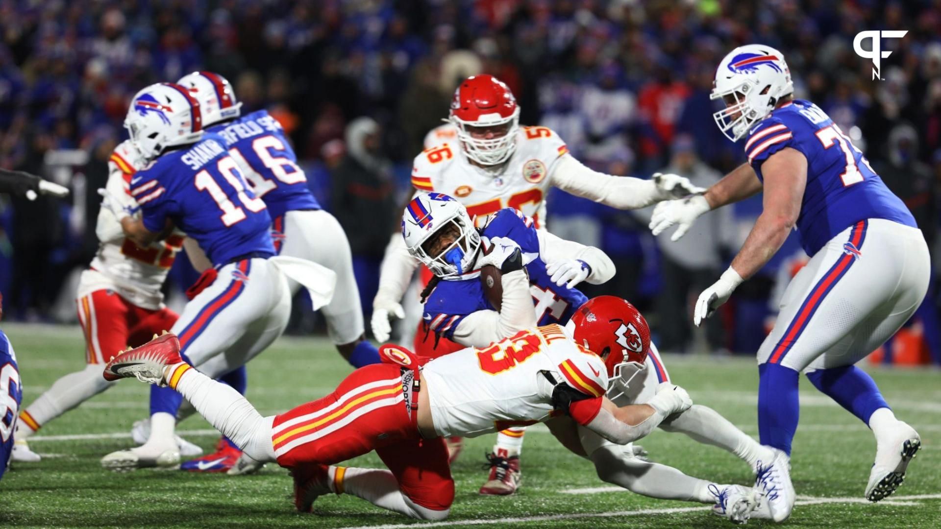 Buffalo Bills RB James Cook (4) is tackled by the Kansas City Chiefs.