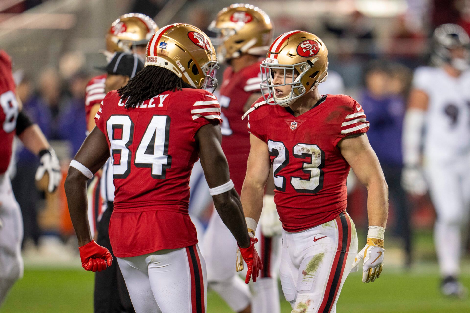 San Francisco 49ers running back Christian McCaffrey (23) and wide receiver Chris Conley (84) celebrate after the touchdown against the Baltimore Ravens during the second quarter at Levi's Stadium.