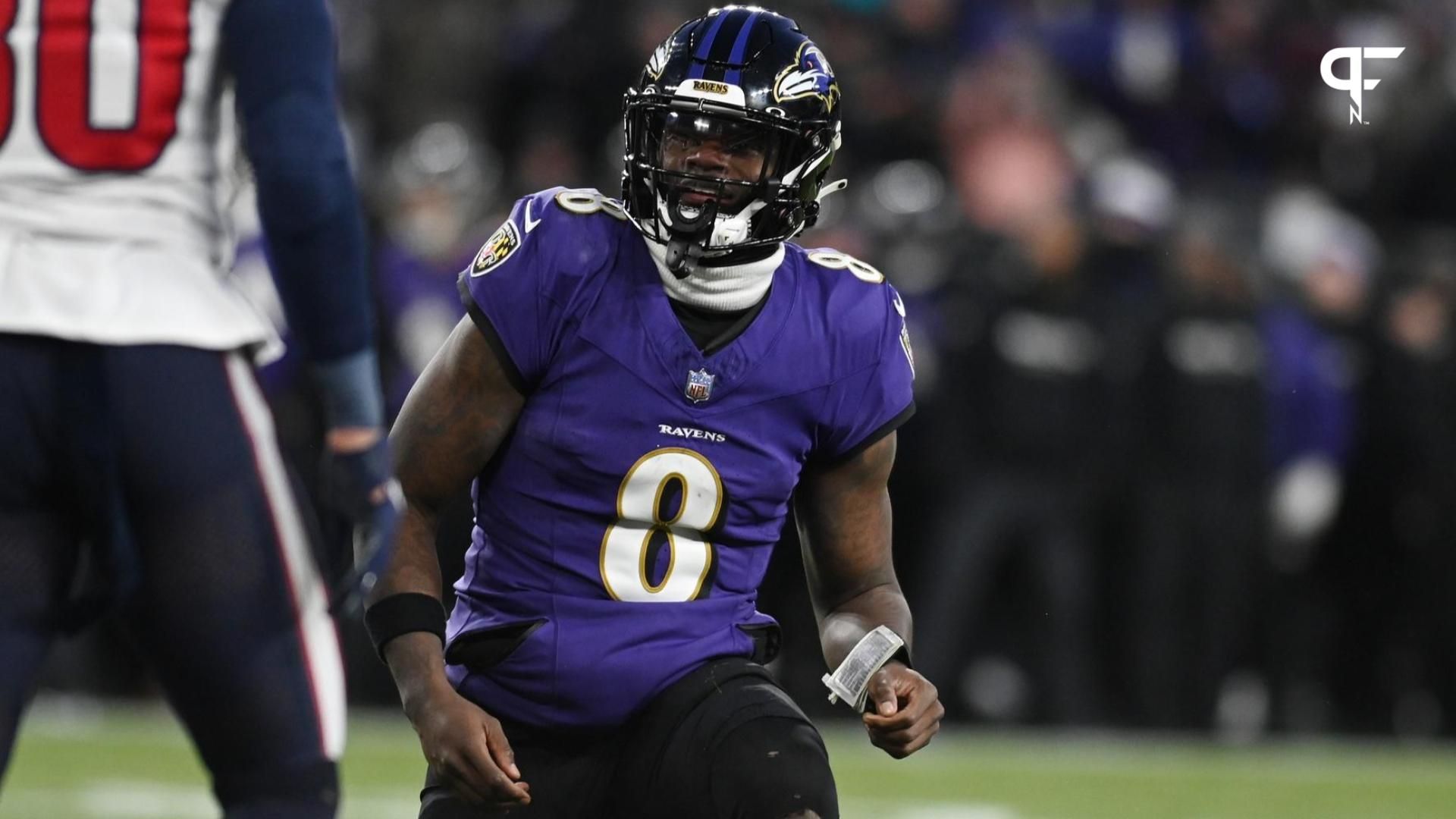 Baltimore Ravens QB Lamar Jackson (8) reacts after throwing a pass against the Houston Texans.