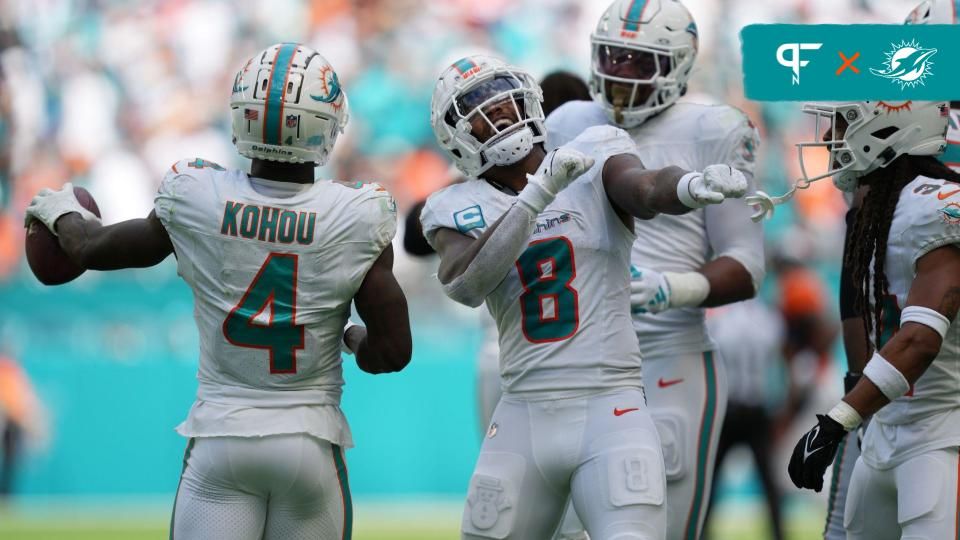 Jevon Holland (8) celebrates creating a turnover against the Denver Broncos that was recovered by cornerback Kader Kohou (4) during the second half of an NFL game at Hard Rock Stadium.