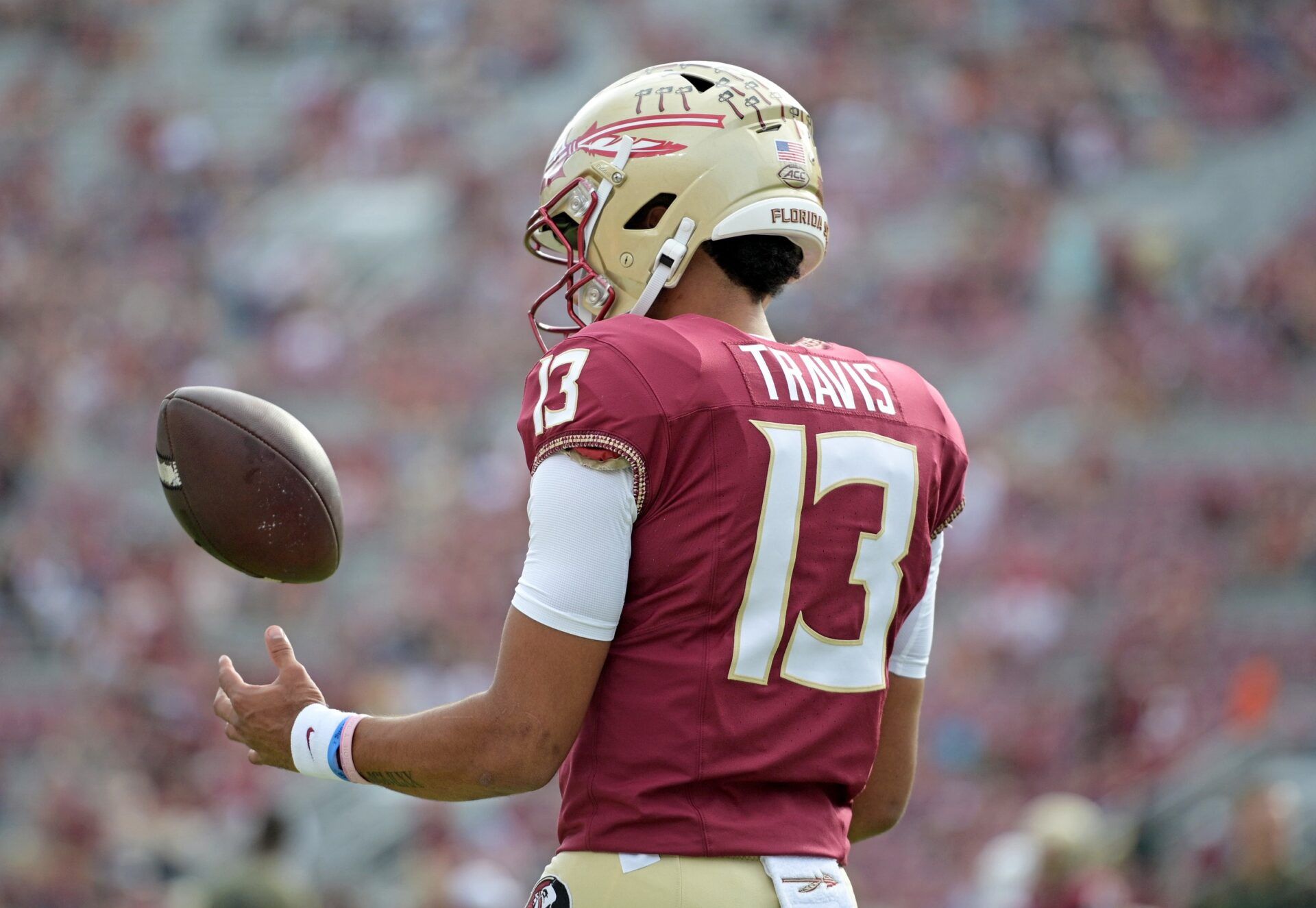 Florida State Seminoles quarterback Jordan Travis (13) takes a moment to himself before the game against the Miami Hurricanes at Doak S. Campbell Stadium.