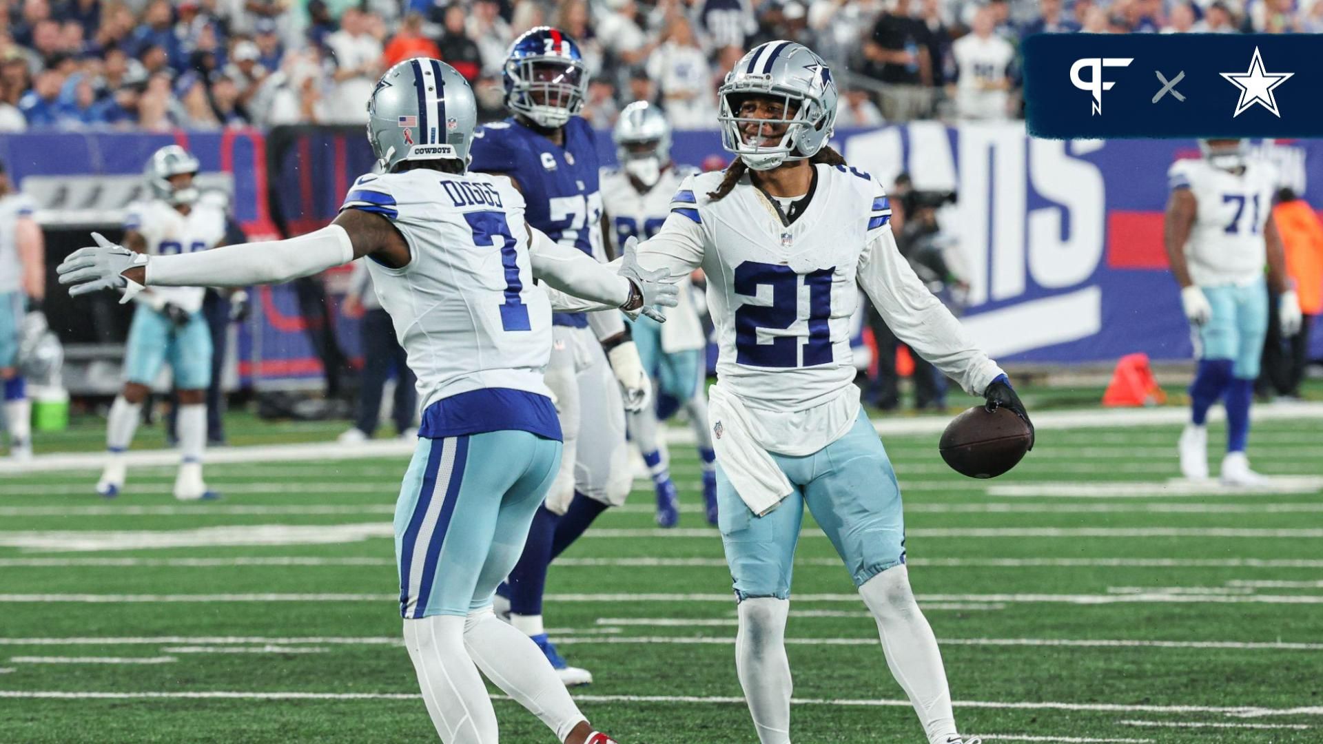 Dallas Cowboys cornerback Stephon Gilmore (21) celebrates his interception with cornerback Trevon Diggs (7) during the first half against the New York Giants at MetLife Stadium.