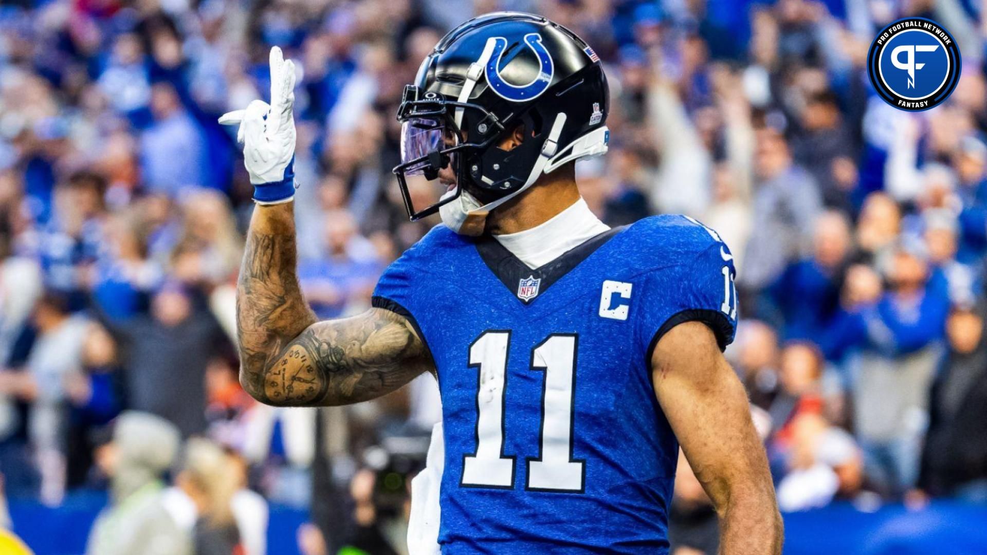 Indianapolis Colts wide receiver Michael Pittman Jr. (11) celebrates his rushing touchdown in the second half against the Cleveland Browns at Lucas Oil Stadium.