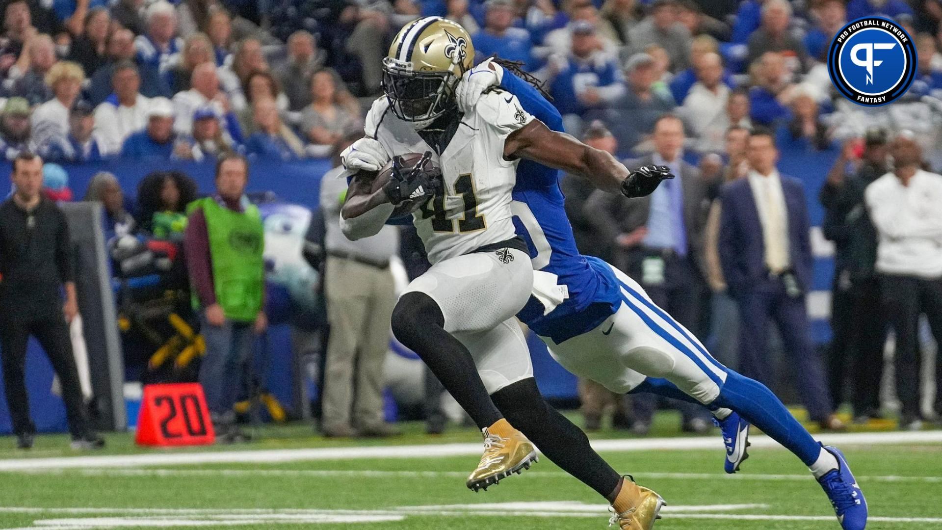 Indianapolis Colts cornerback Jaylon Jones (40) hangs onto New Orleans Saints running back Alvin Kamara (41) as he runs in a touchdown Sunday, Oct. 29, 2023, at Lucas Oil Stadium in Indianapolis.