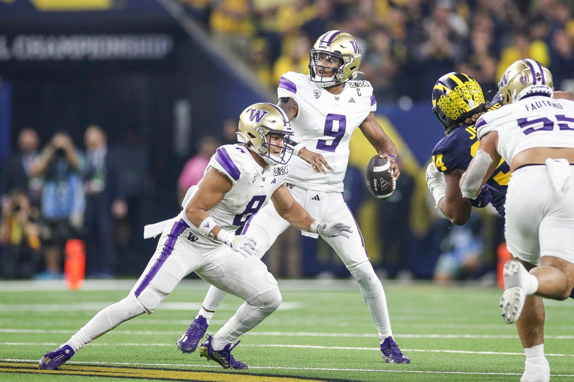 Washington quarterback Michael Penix Jr. looks to pass against Michigan during the first half of the national championship game at NRG Stadium