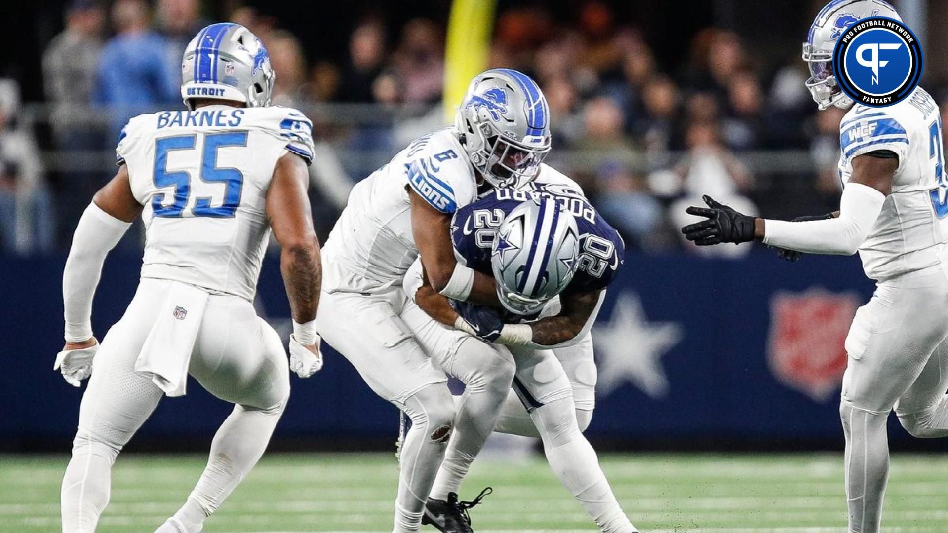 Detroit Lions safety Ifeatu Melifonwu (6) tackles Dallas Cowboys running back Tony Pollard (20) during the second half at AT&T Stadium in Arlington, Texas on Saturday, Dec. 30, 2023.