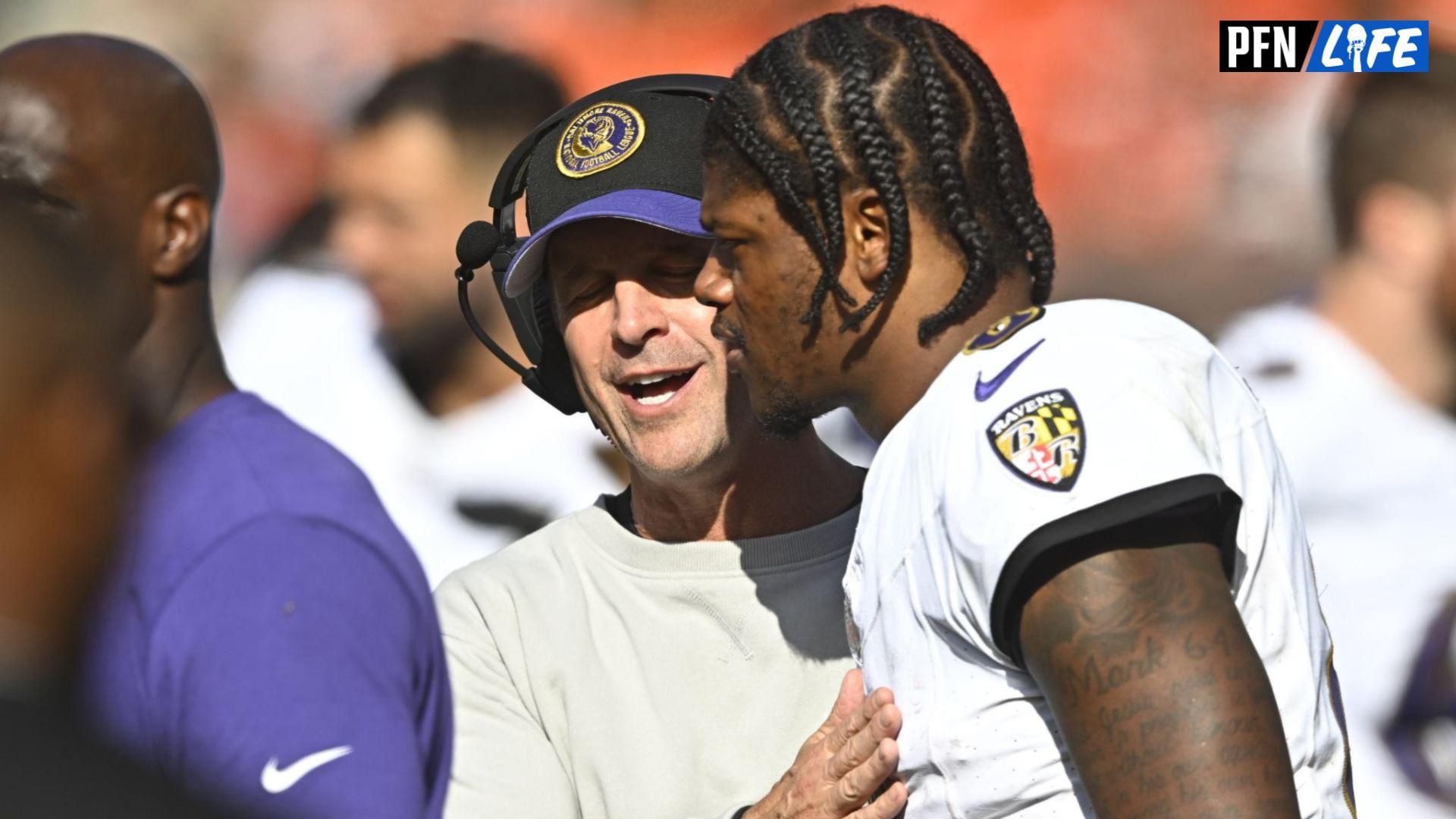 Baltimore Ravens head coach John Harbaugh talks with quarterback Lamar Jackson (8) in the fourth quarter against the Cleveland Browns at Cleveland Browns Stadium.