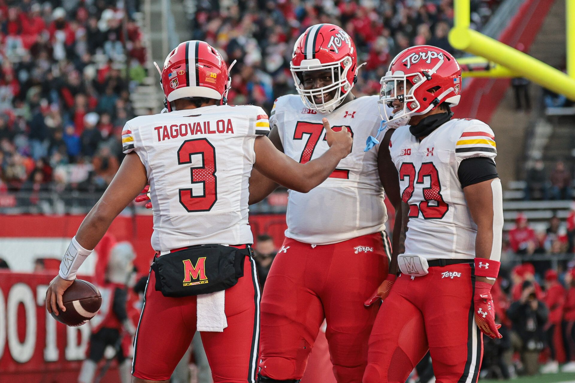 Maryland Terrapins quarterback Taulia Tagovailoa (3) celebrates his rushing touchdown with offensive lineman Gottlieb Ayedze (72) and running back Colby McDonald (23) during the first half against the Rutgers Scarlet Knights at SHI Stadium.