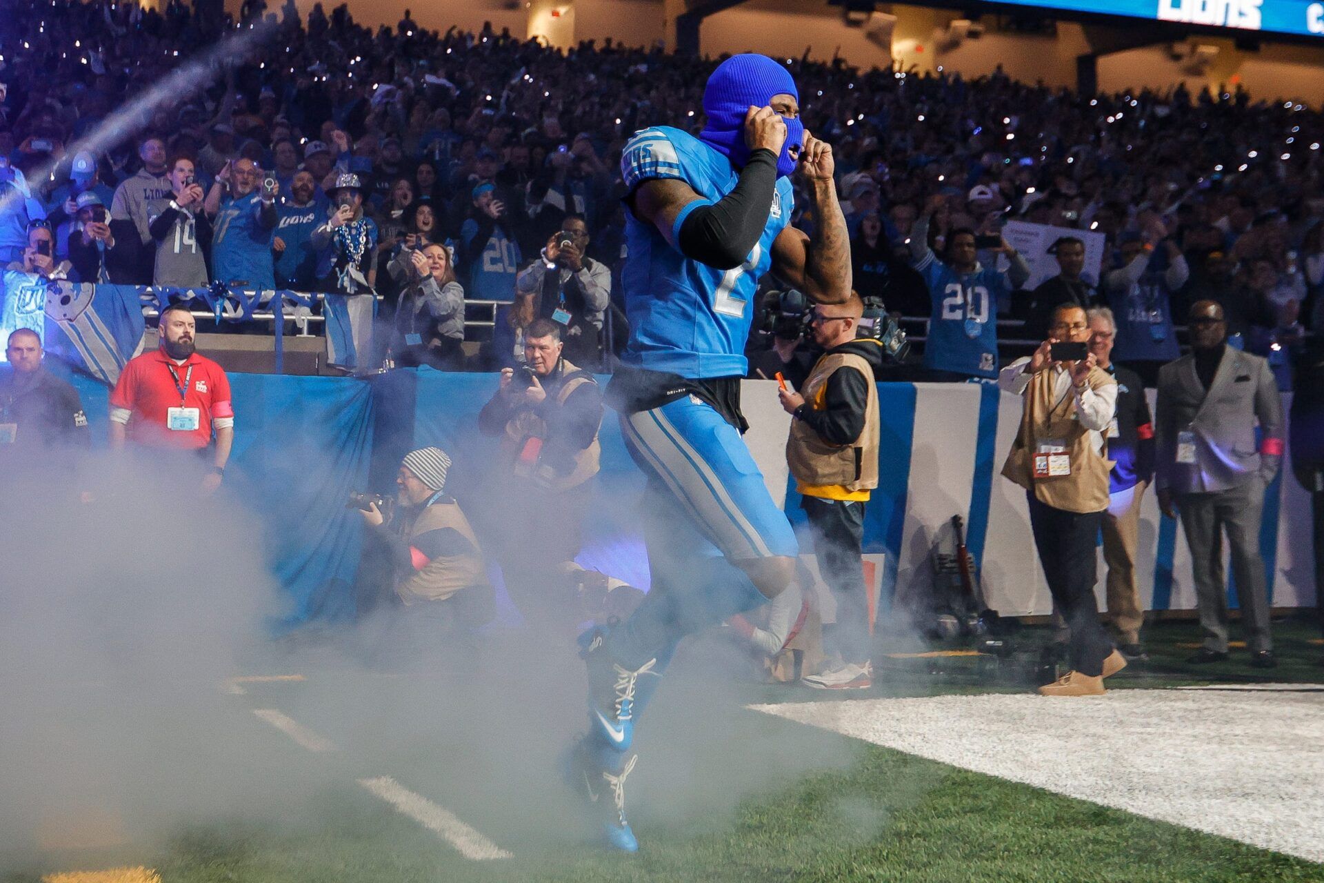 Detroit Lions safety C.J. Gardner-Johnson runs out of the tunnel for player introductions before kickoff against the Tampa Bay Buccaneers in an NFC divisional round playoff game