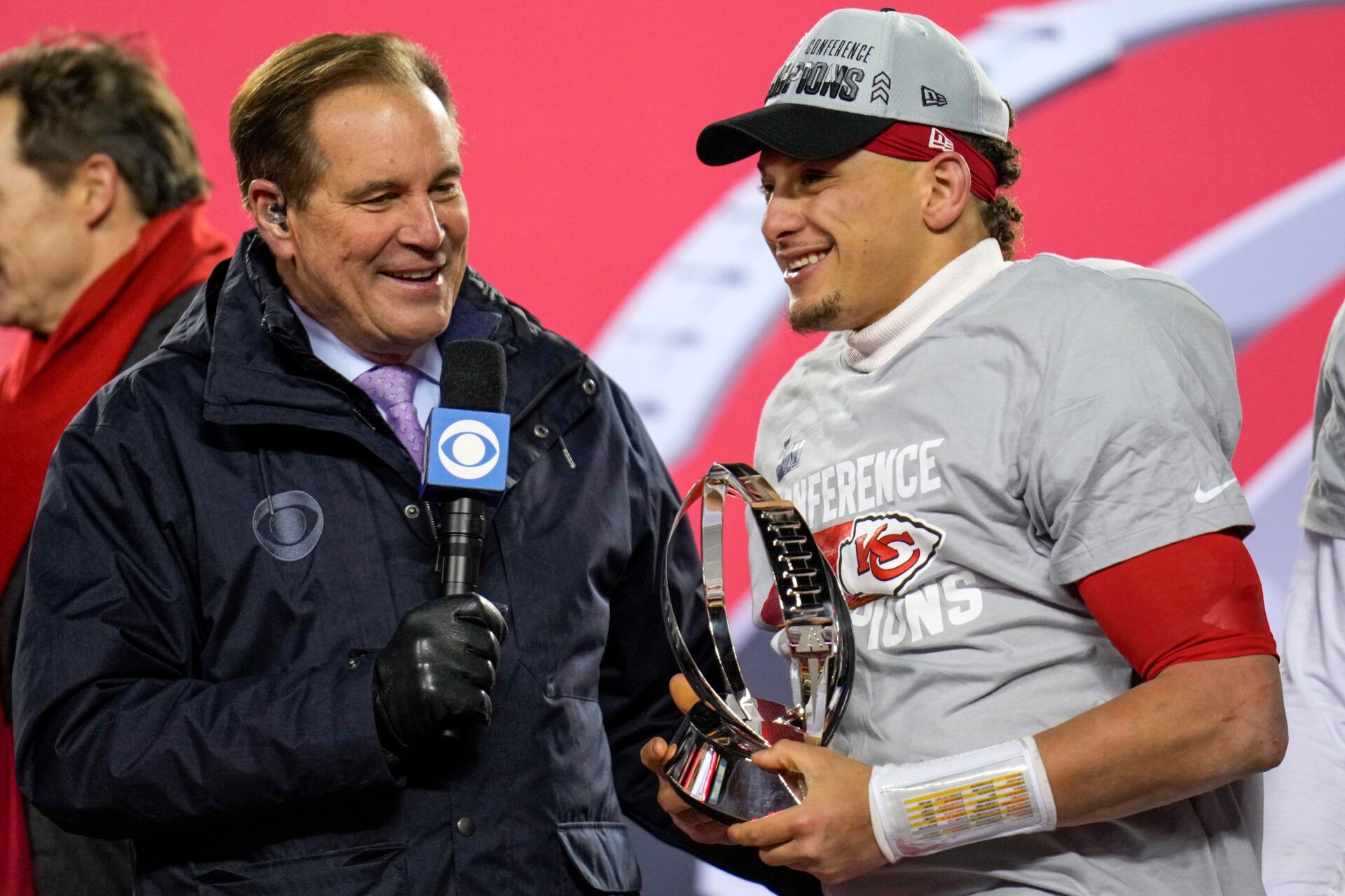 Jim Nantz presents the Lamar Hunt Trophy to Kansas City Chiefs quarterback Patrick Mahomes (15) after the AFC championship NFL game between the Cincinnati Bengals and the Kansas City Chiefs, Sunday, Jan. 29, 2023, at Arrowhead Stadium in Kansas City, Mo.