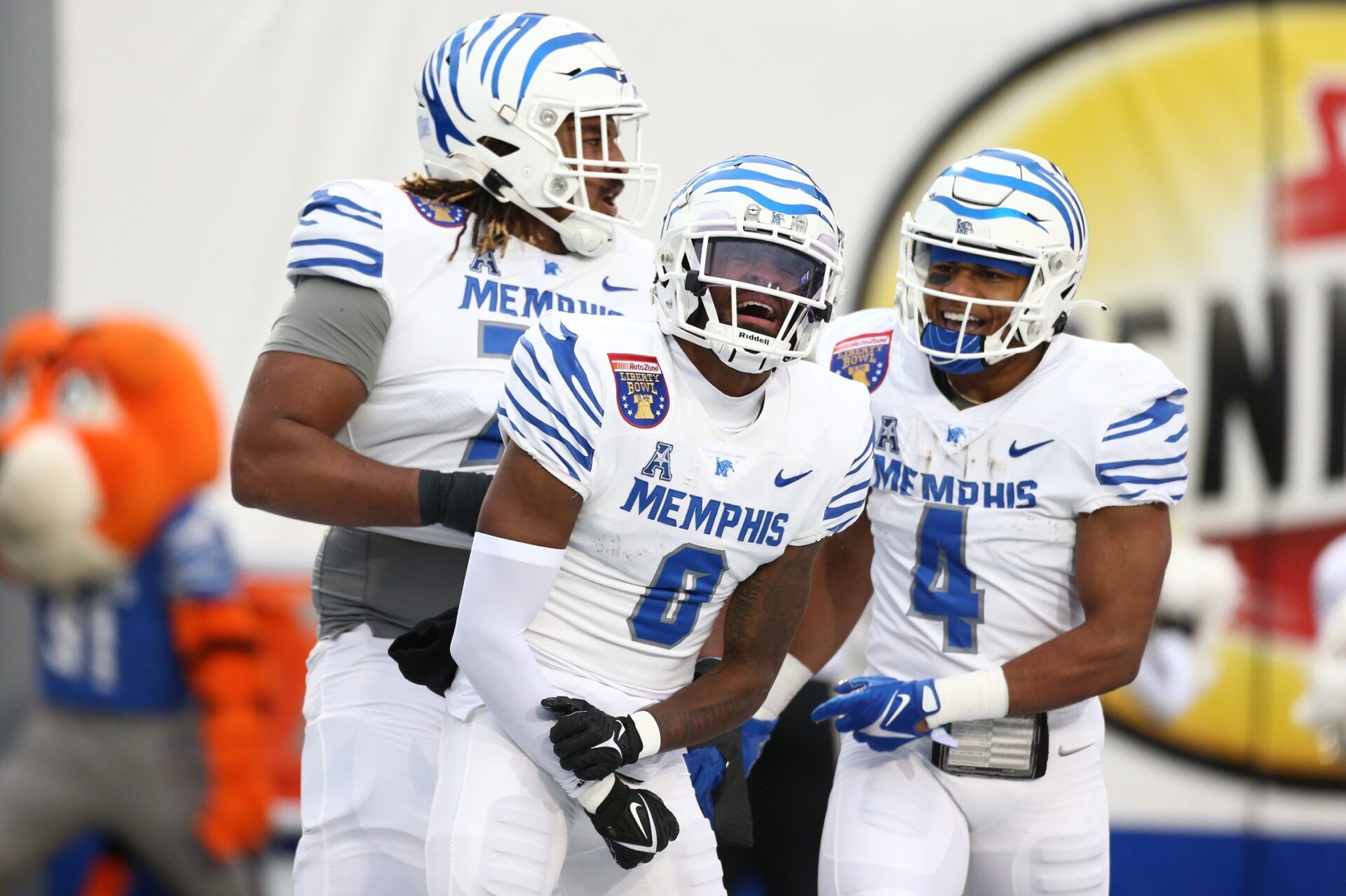 Memphis Tigers wide receiver Demeer Blankumsee (0) reacts with offensive linemen Xavier Hill (71) and running back Blake Watson (4) after a touchdown during the first half against the Iowa State Cyclones at Simmons Bank Liberty Stadium.