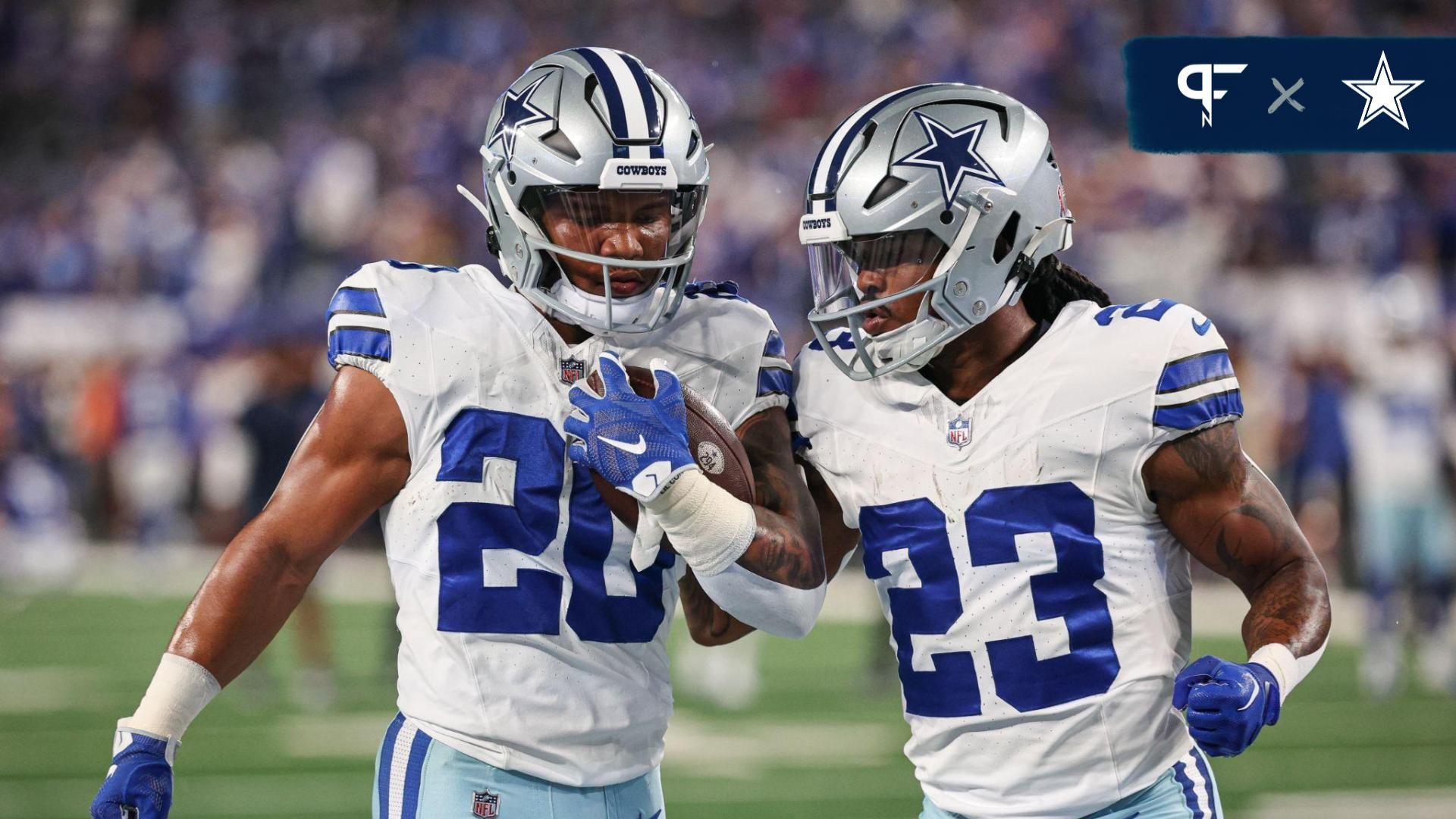 Dallas Cowboys running back Tony Pollard (20) and running back Rico Dowdle (23) warm up before the game against the New York Giants at MetLife Stadium.