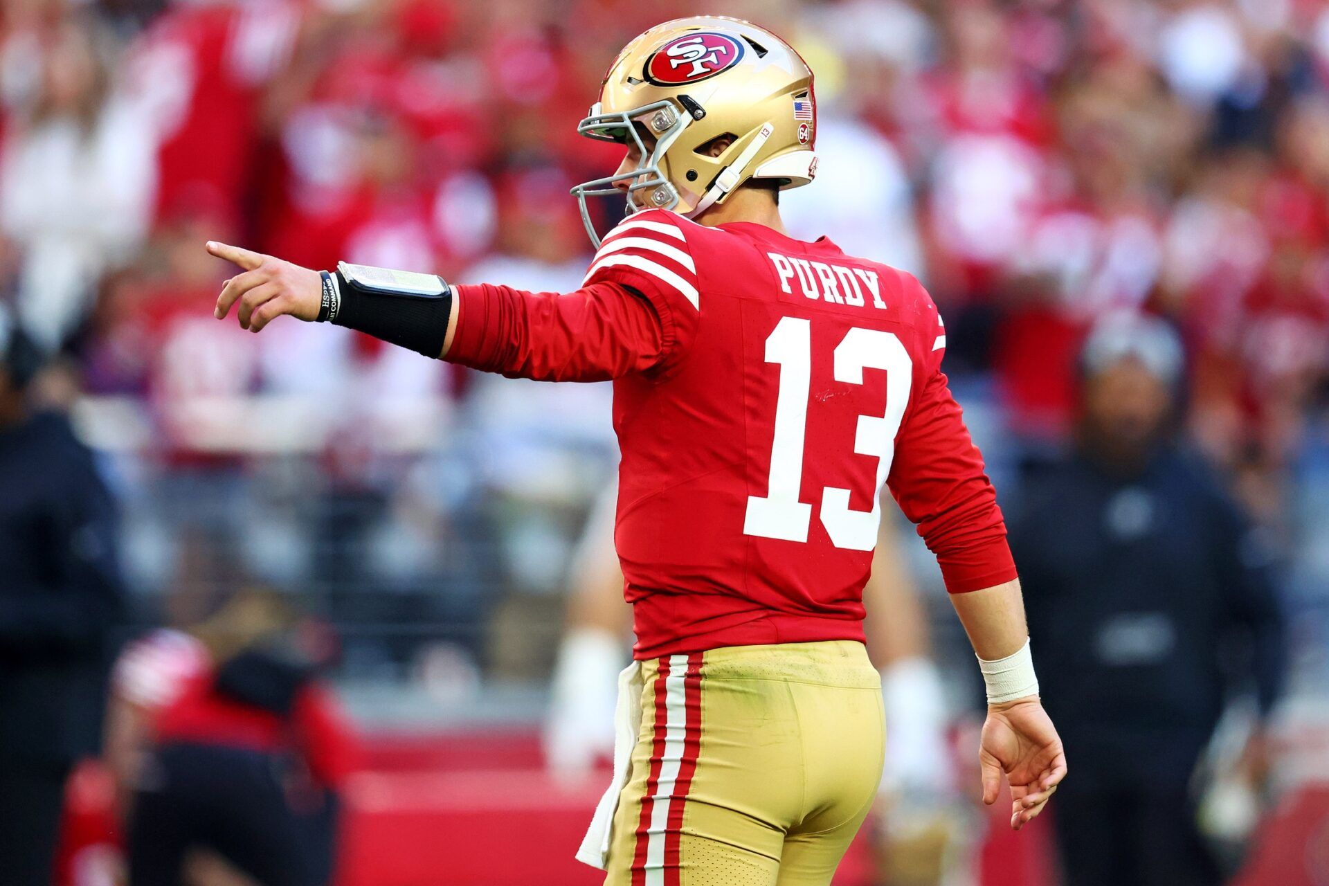 San Francisco 49ers quarterback Brock Purdy (13) points during the first half against the Arizona Cardinals at State Farm Stadium.