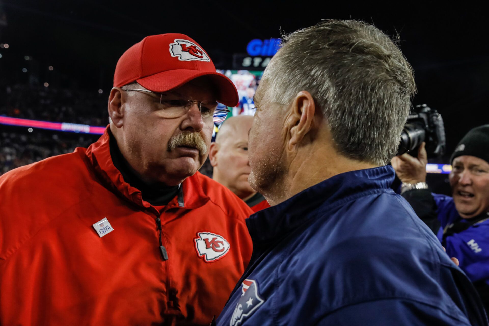 Kansas City Chiefs head coach Andy Reid meets New England Patriots head coach Bill Belichick on the field after the game at Gillette Stadium.