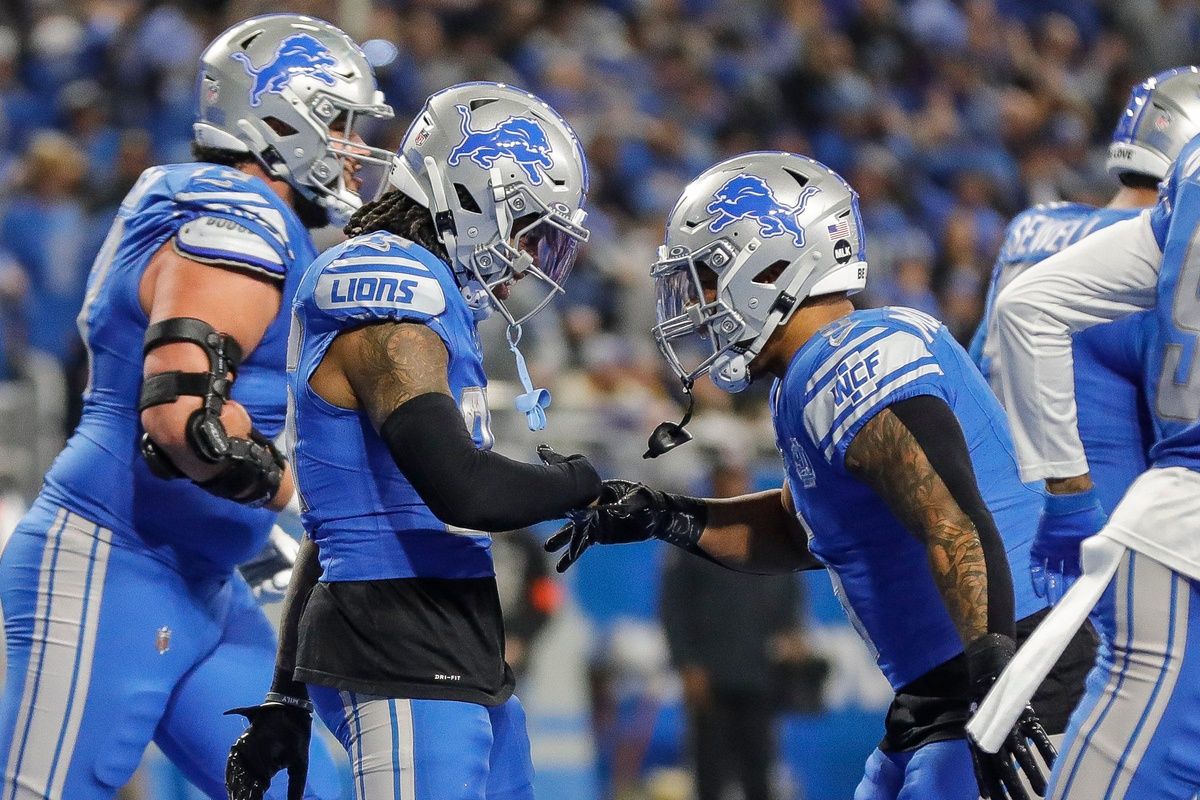 Lions running backs Jahmyr Gibbs, left, and David Montgomery celebrate a touchdown during the first half of the 24-23 win over the Rams.