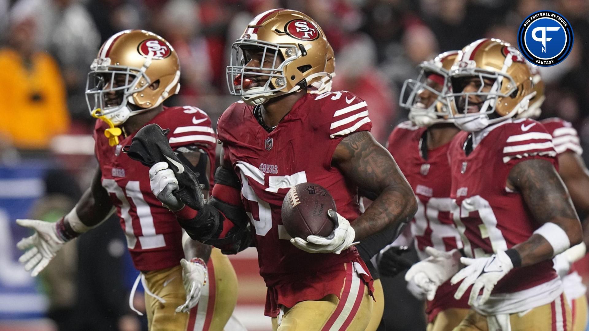 San Francisco 49ers linebacker Dre Greenlaw (57) celebrates his interception during the third quarter at Levi's Stadium.